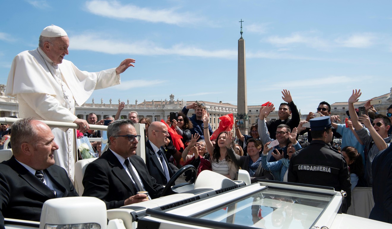 Pope Francis greets faithful during the weekly general audience at the Vatican. Photo: Handout via Reuters