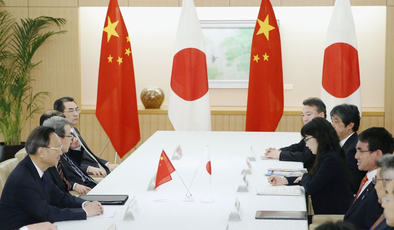 China and Japan should work together to defend the global trading system, Yang Jiechi said during his trip to Tokyo. Photo: Kyodo