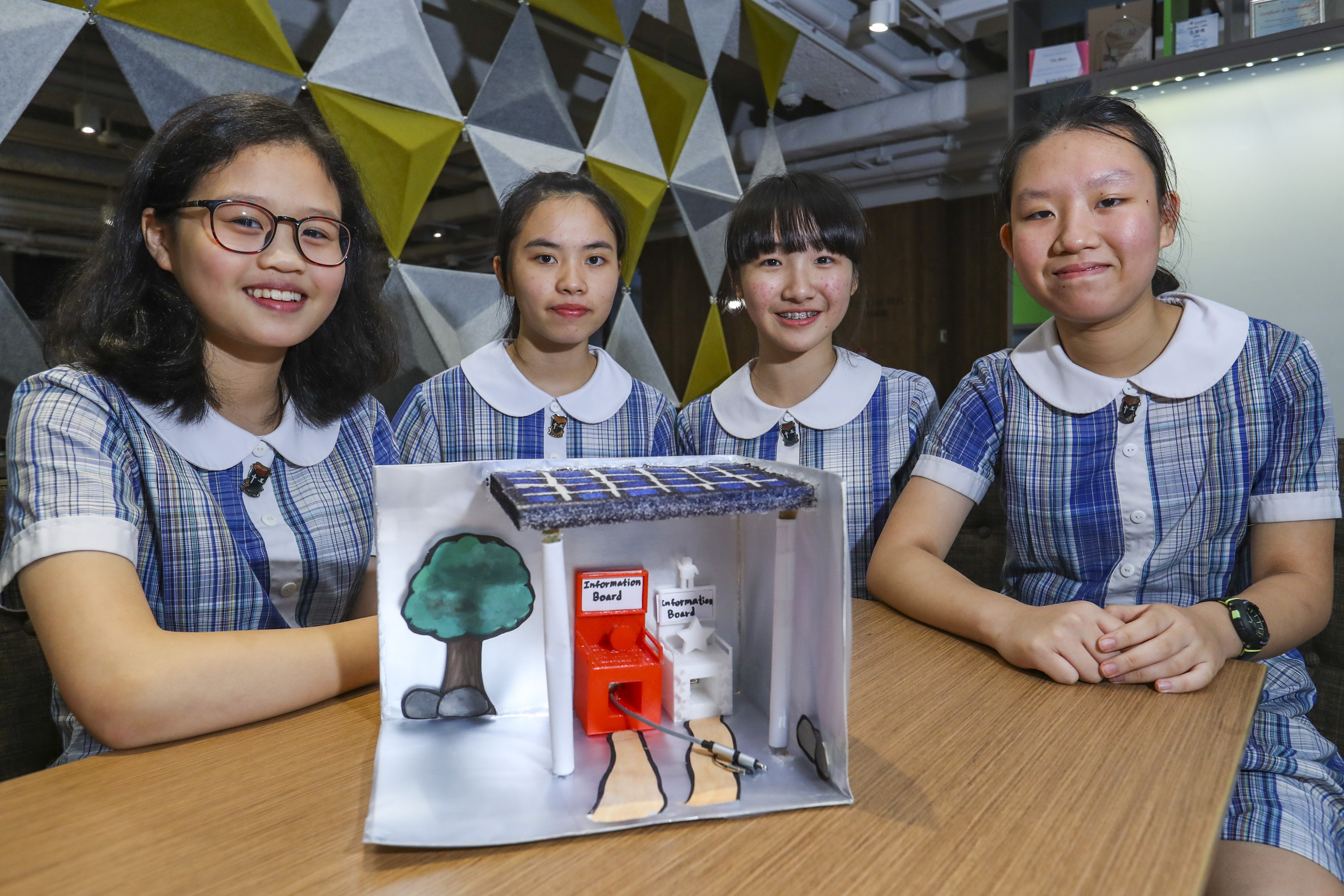 Left to right: Jenny Leung, Wincy Tang, Celia Yan and Susan Li of Leung Shek Chee College and their project at The Schools Challenge Hong Kong – Live Smart @ Kowloon East at The Wave in Kwun Tong. Photo: Edmond So