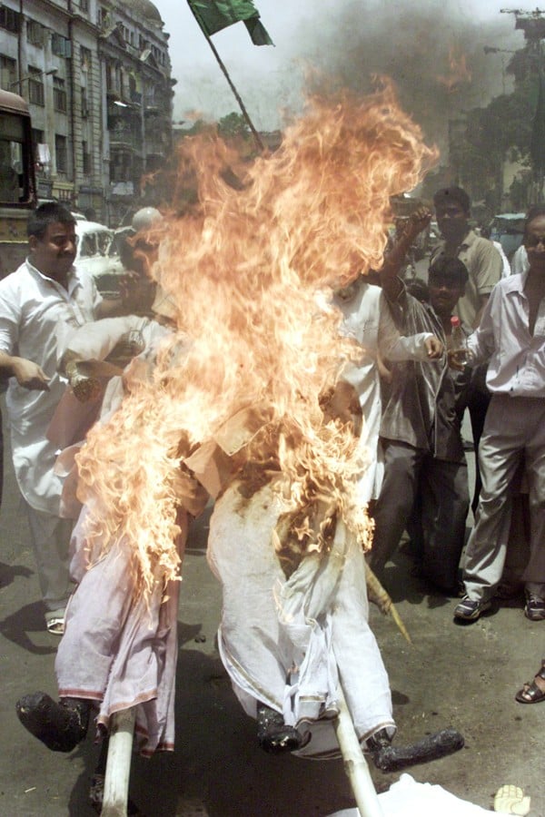 Activists burn an effigy of Narendra Modi, then Chief Minister of Gujarat, during a 2002 demonstration against the communal riots. Photo: Reuters