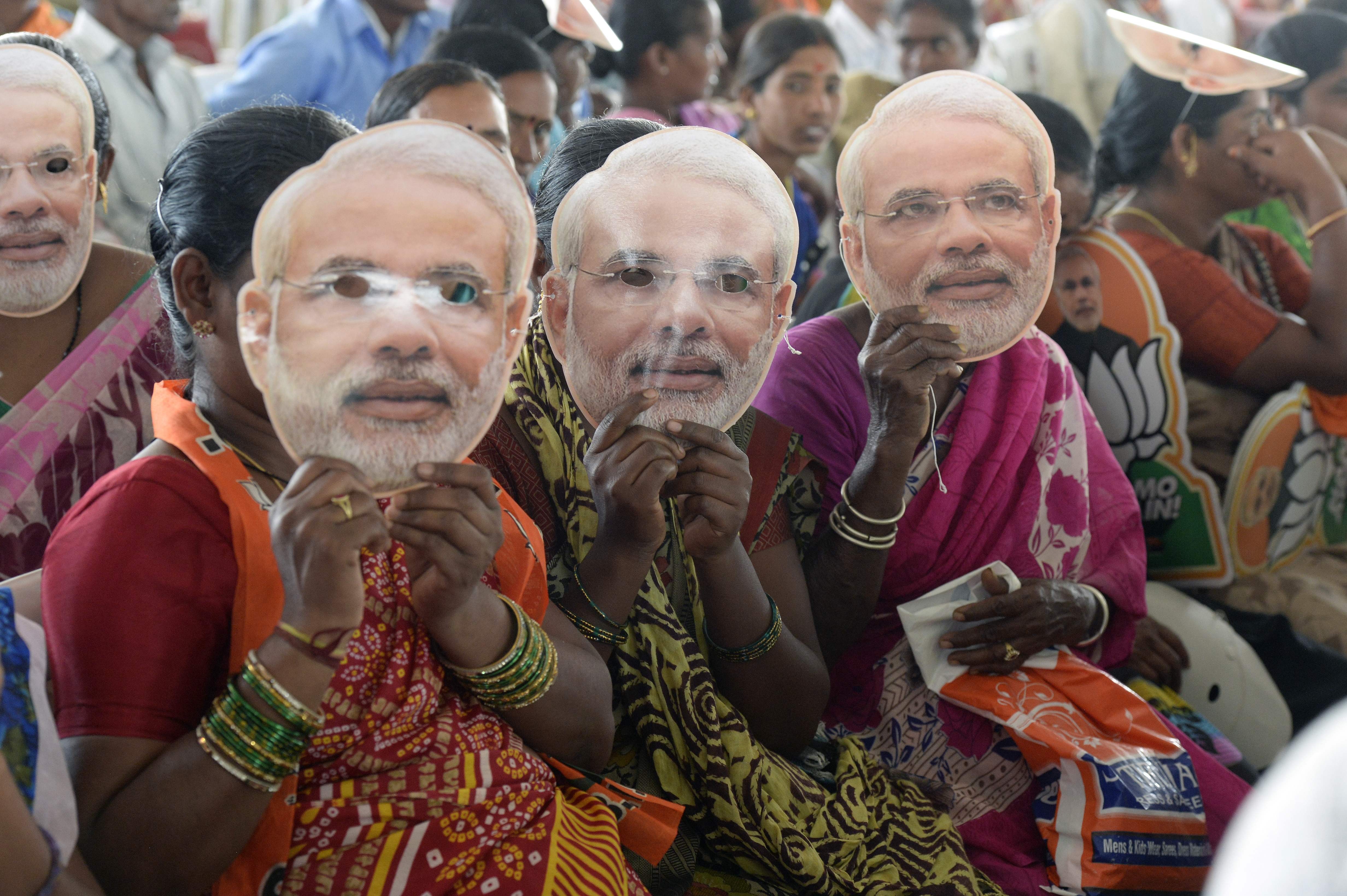 Women supporting the Bharatiya Janata Party wear masks of Prime Minister Narendra Modi at a rally in Hyderabad last month. Photo: AFP