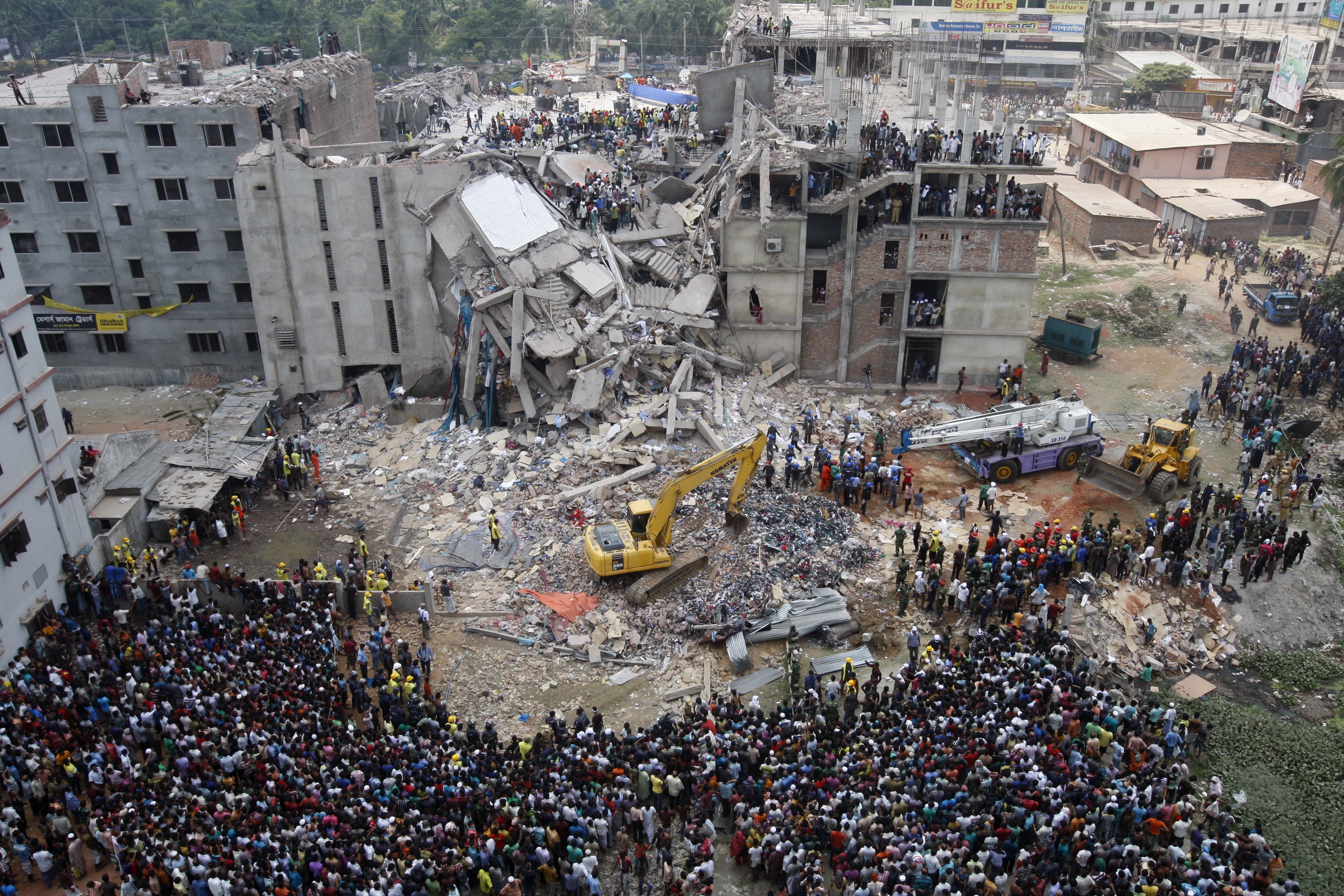 Rescuers at the collapsed Rana Plaza building in 2013. Photo: EPA