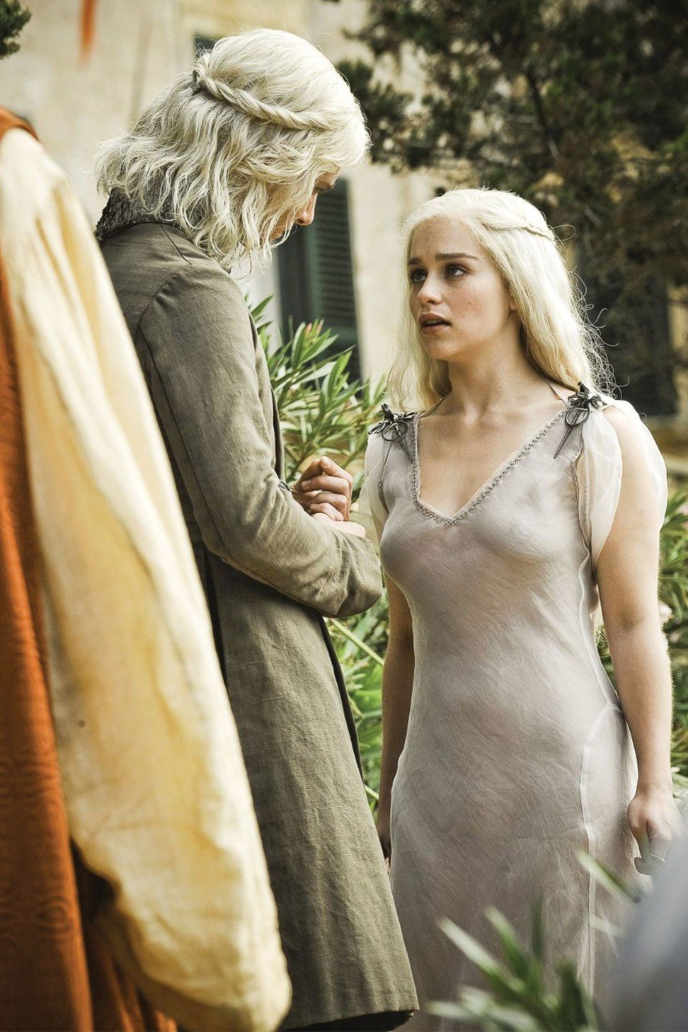 Our first glimpse of a young Daenerys Targaryen (right), portrayed by Emilia Clarke, with Viserys Targaryen, played by Harry Lloyd, in Season 1 of Game of Thrones.