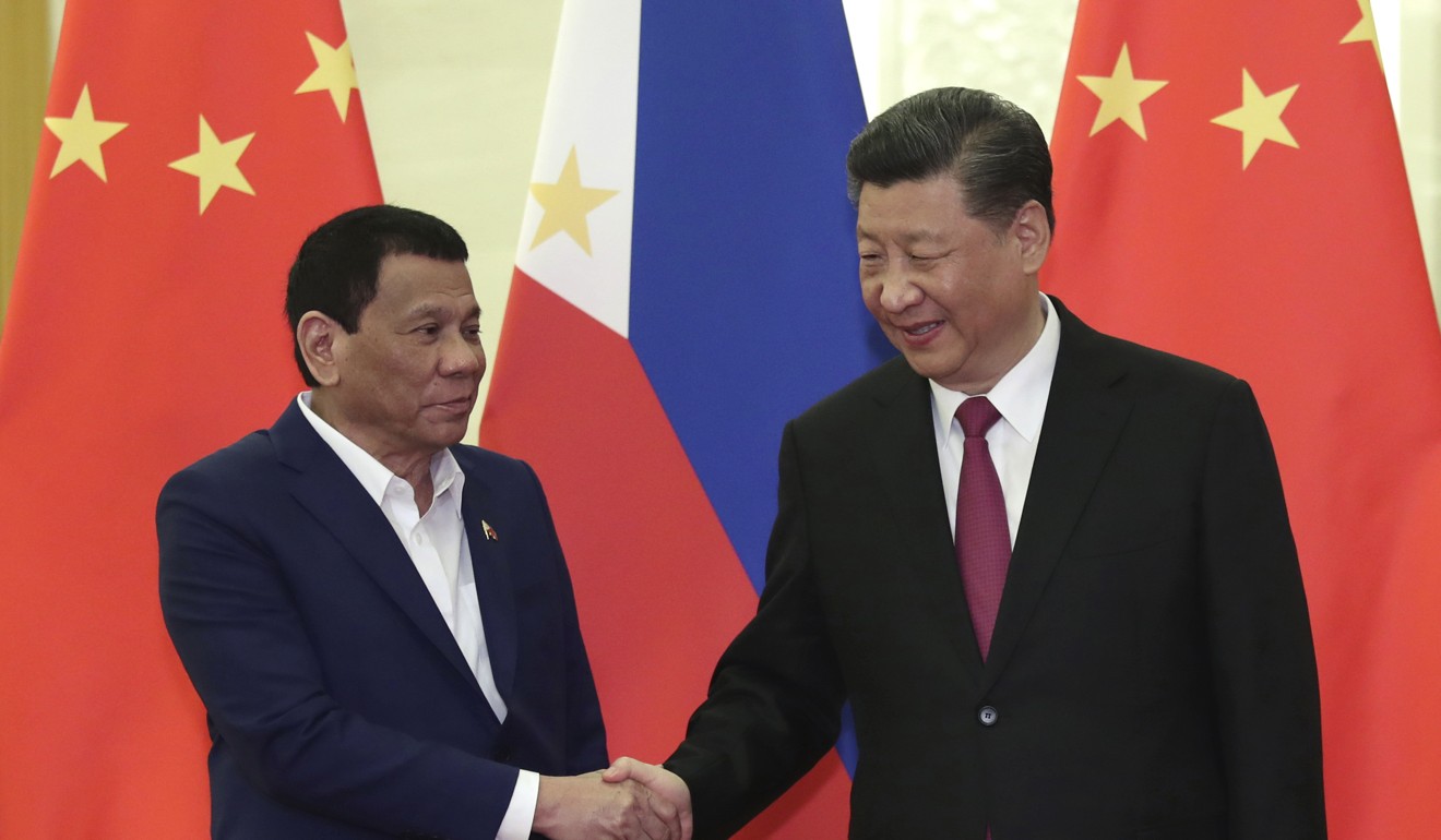 Rodrigo Duterte, pictured with Xi Jinping, has tried to improve ties with Beijing. Photo: AP