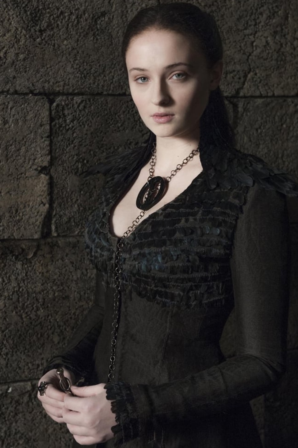 The iconic dark dress, with a feather-covered bodice and winged sleeves, worn by Sophie Turner as Sansa Stark in Game of Thrones.