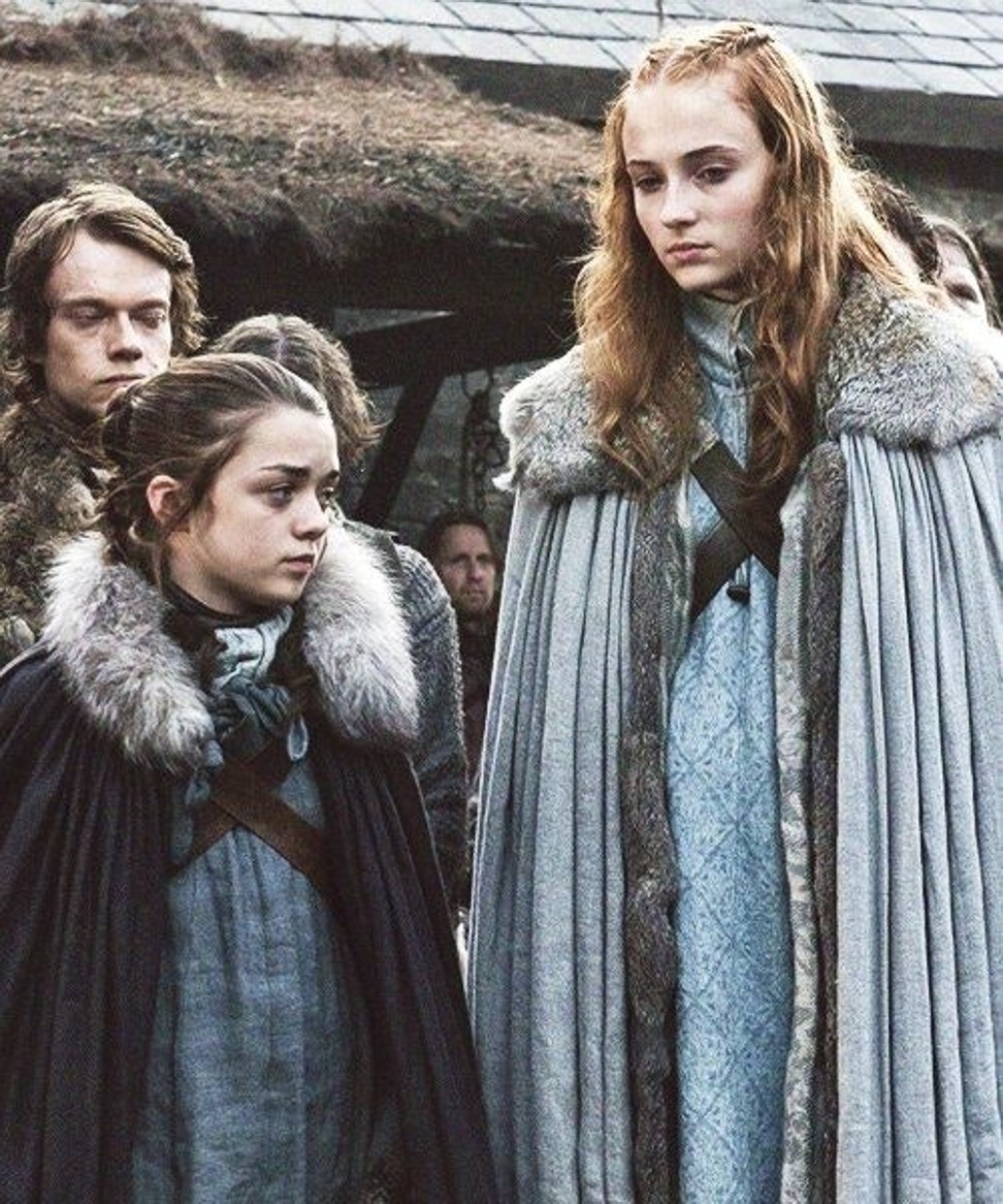 The young Sansa Stark (right), played by Sophie Turner, in her opening scene in Game of Thrones.