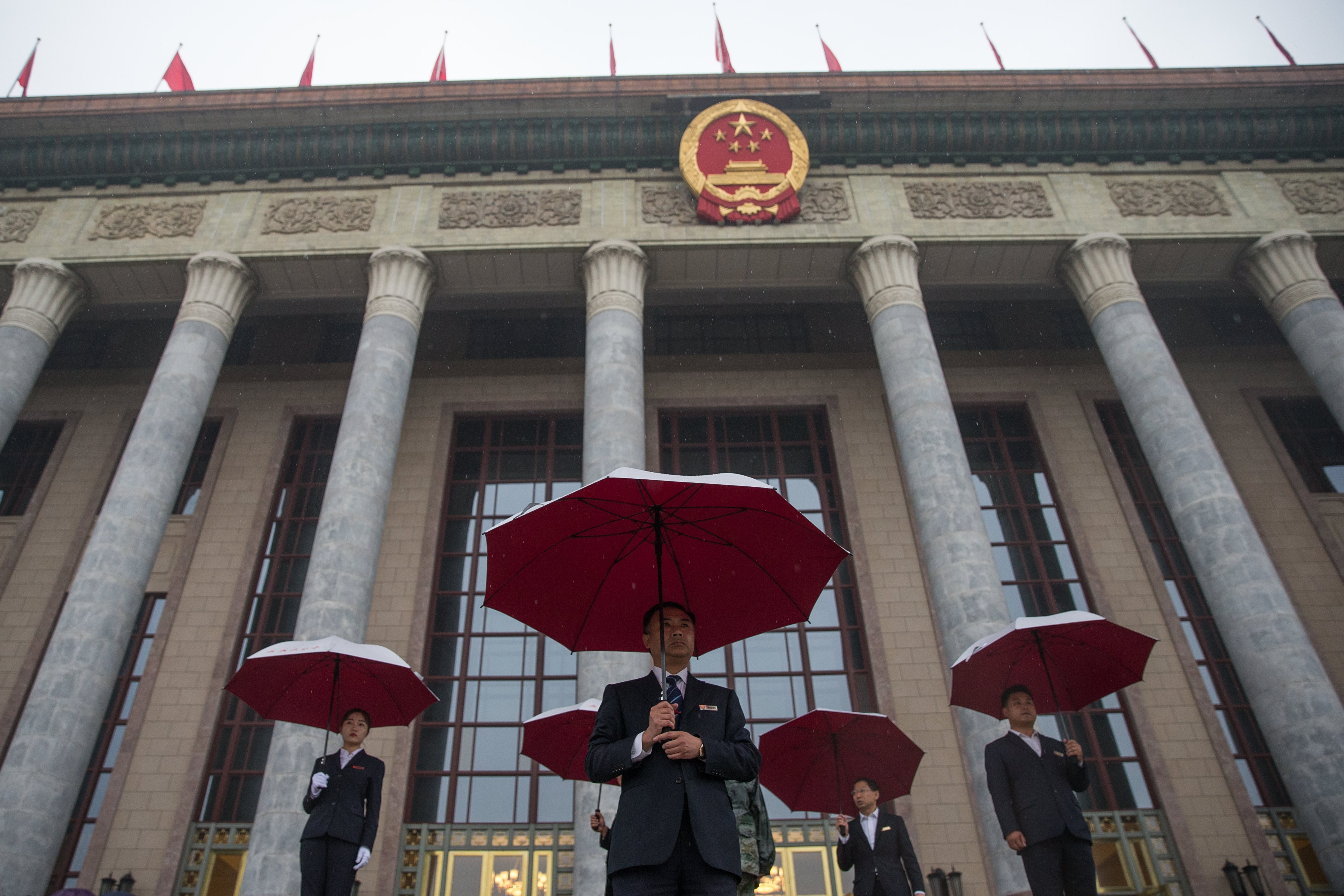 China is prepared for the global turbulence with its decades-long use of five-year plans, the latest of which was made in 2017, at the Great Hall of the People in Beijing, seen here on October 18, with security officers standing guard before the opening ceremony of the 19th National Congress of the Communist Party of China. Photo: EPA-EFE