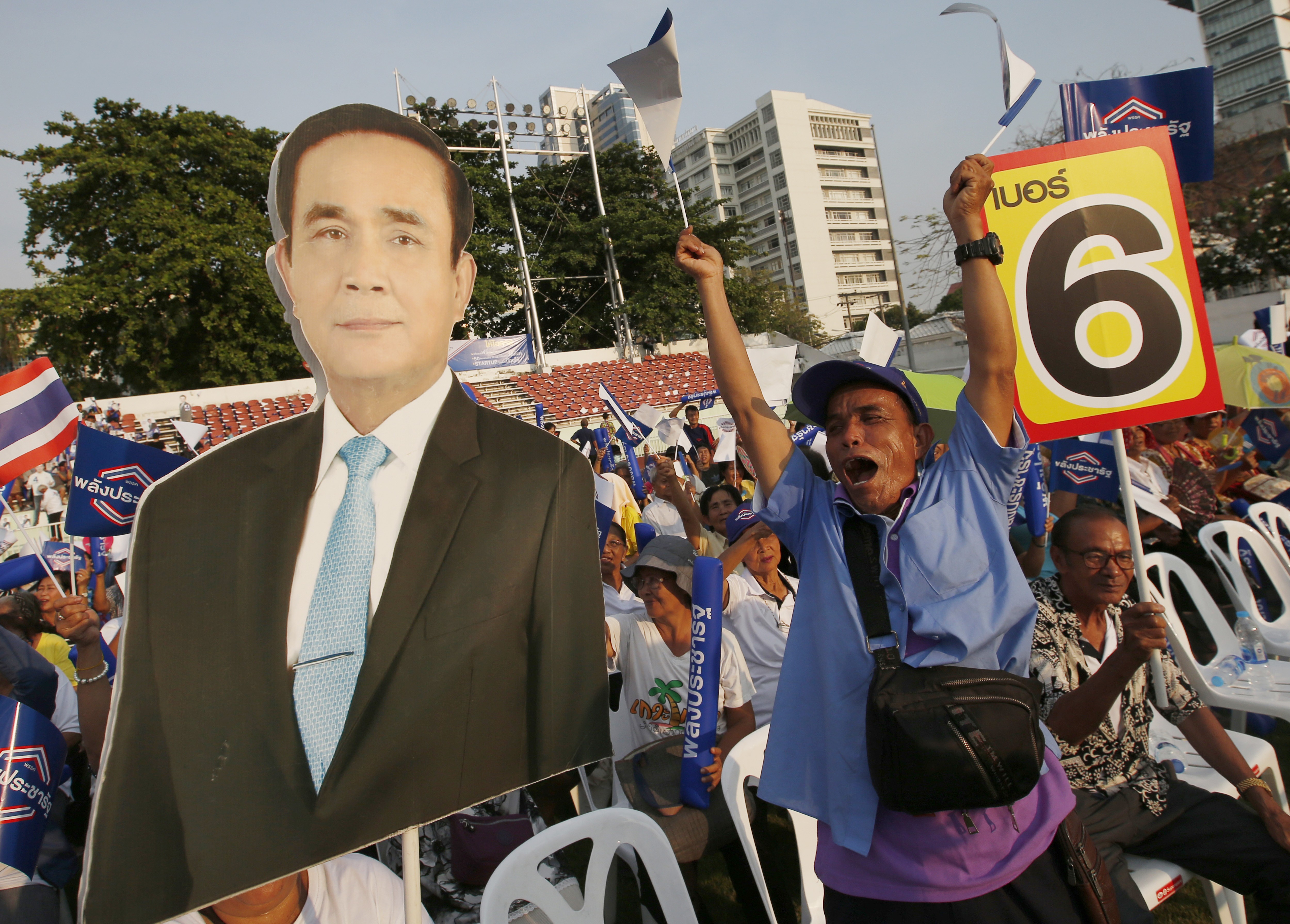 Supporters of the Palang Pracharat Party hold a poster of the Thai Prime Minister Prayuth Chan-ocha during a rally in Bangkok. Photo: AP