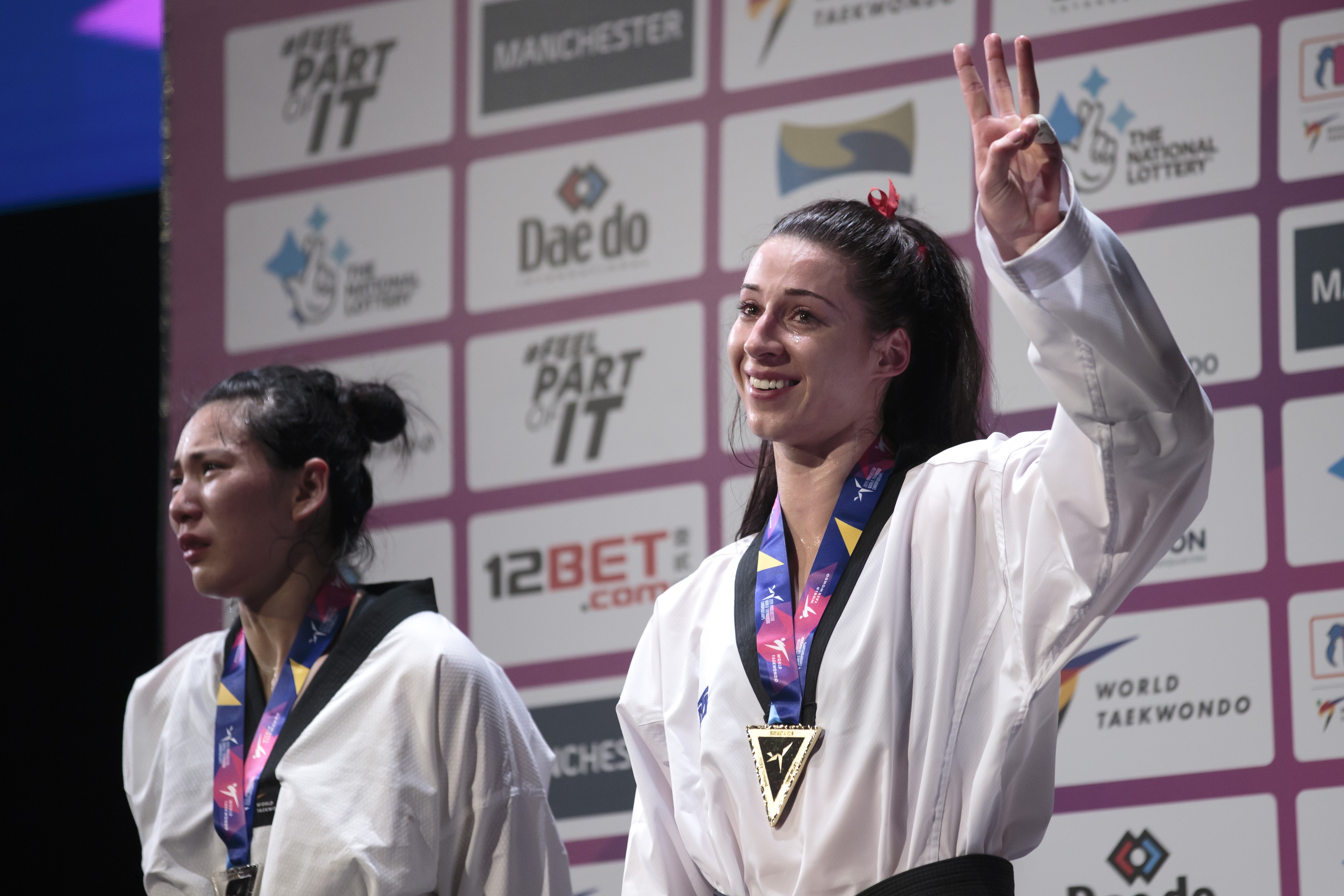 China’s Zheng Shuyin cries as she stands on the podium after being controversially beaten by Britain’s Bianca Walkden in the women’s +73kg final at the World Taekwondo Championships in Manchester. Photos: Xinhua