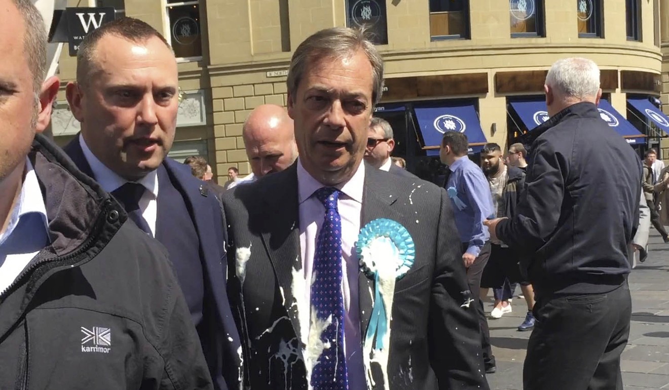 Brexit Party leader Nigel Farage after being hit with a milkshake during a campaign walkabout. Photo: PA via AP