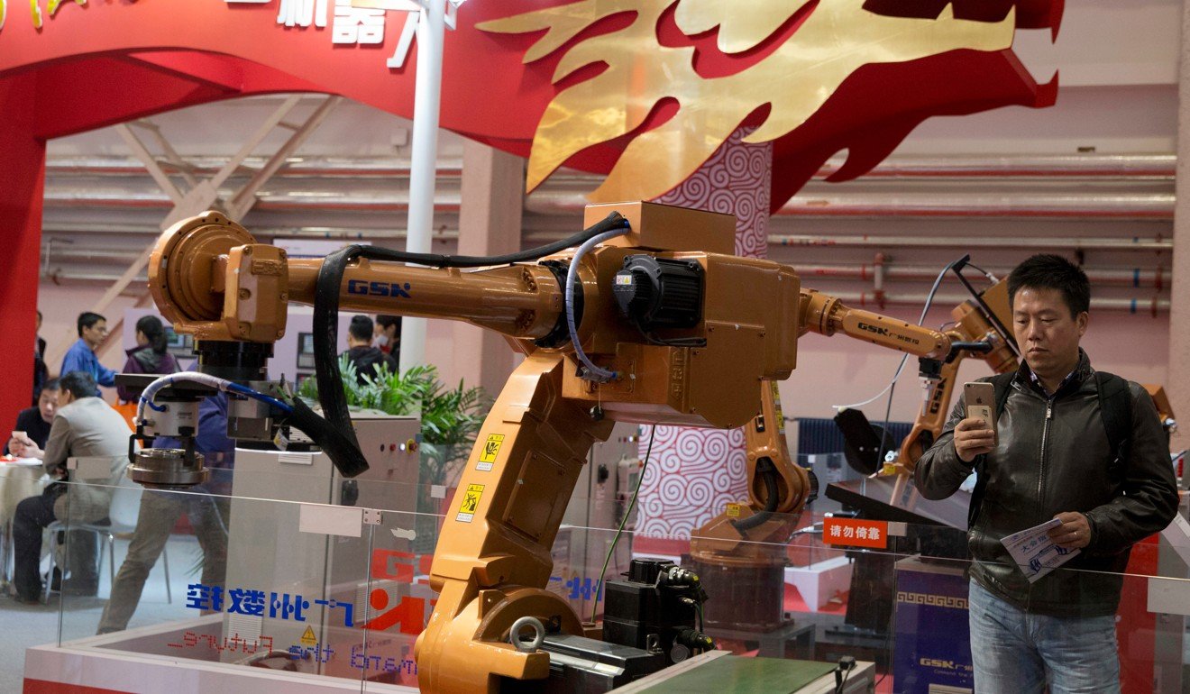 Industrial robots at an expo in Beijing were on show to sell China’s broad industrial ambitions. Photo: AP