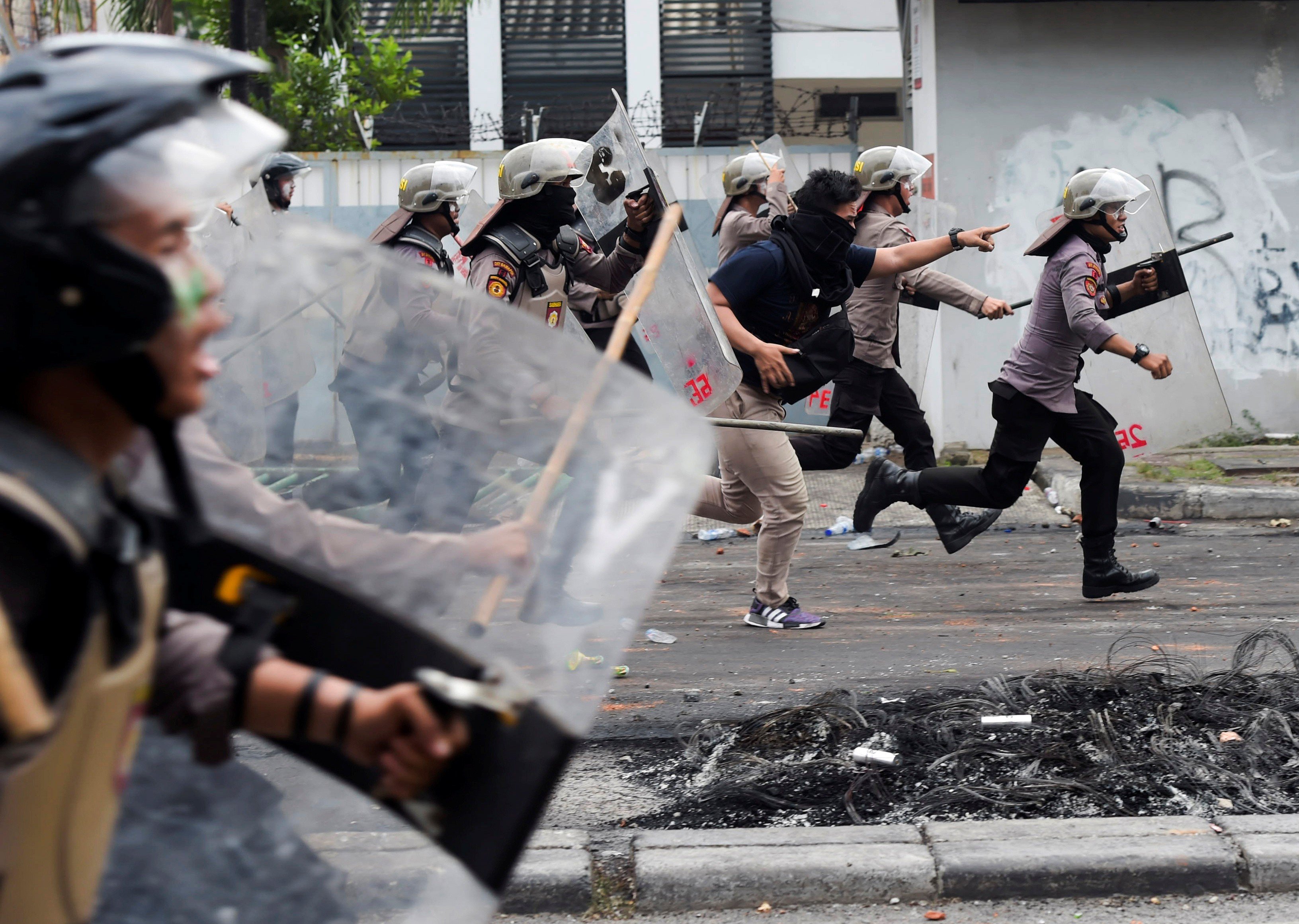 Police disperse protesters at Tanah Abang in Jakarta. Photo: Reuters