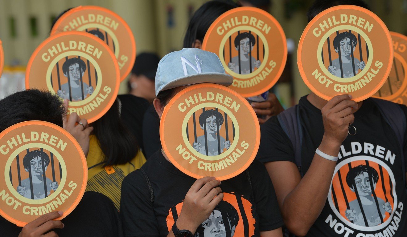 Activists protest against the lowering of the minimum age of criminal responsibility in the Philippines. Photo: Ted Aljibe/AFP