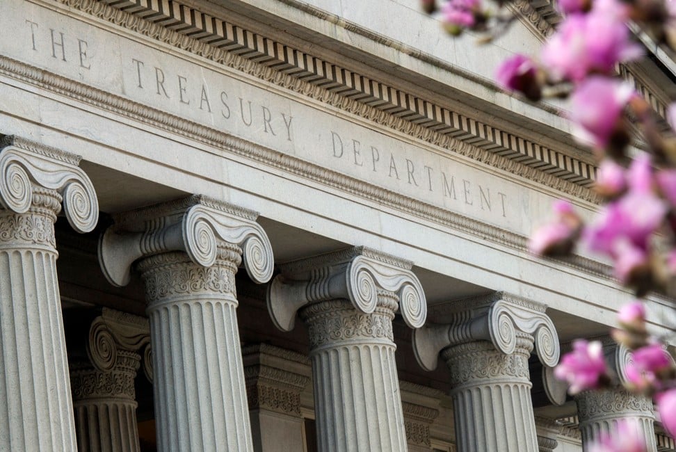 Flowers bloom on a tree bloom near the US Treasury Department building in Washington, DC. Photo: Agence France-Presse