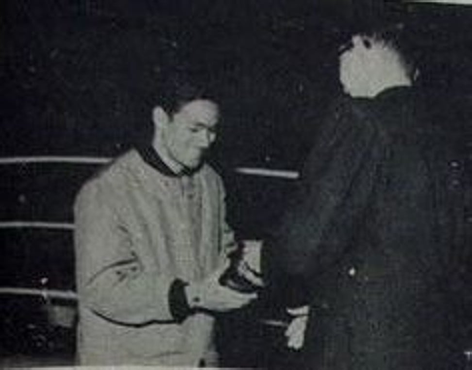 A young Bruce Lee receives his winner's medal after defeating Gary Elms.