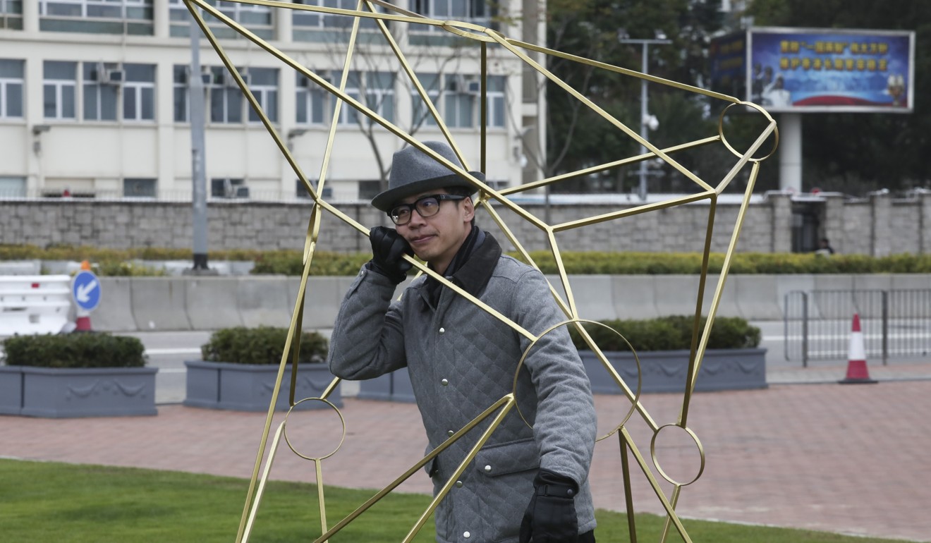 Kacey Wong Kwok-choi, a visual artist, with one of his works at the Harbour Arts Sculpture Park. Photo: Jonathan WONG
