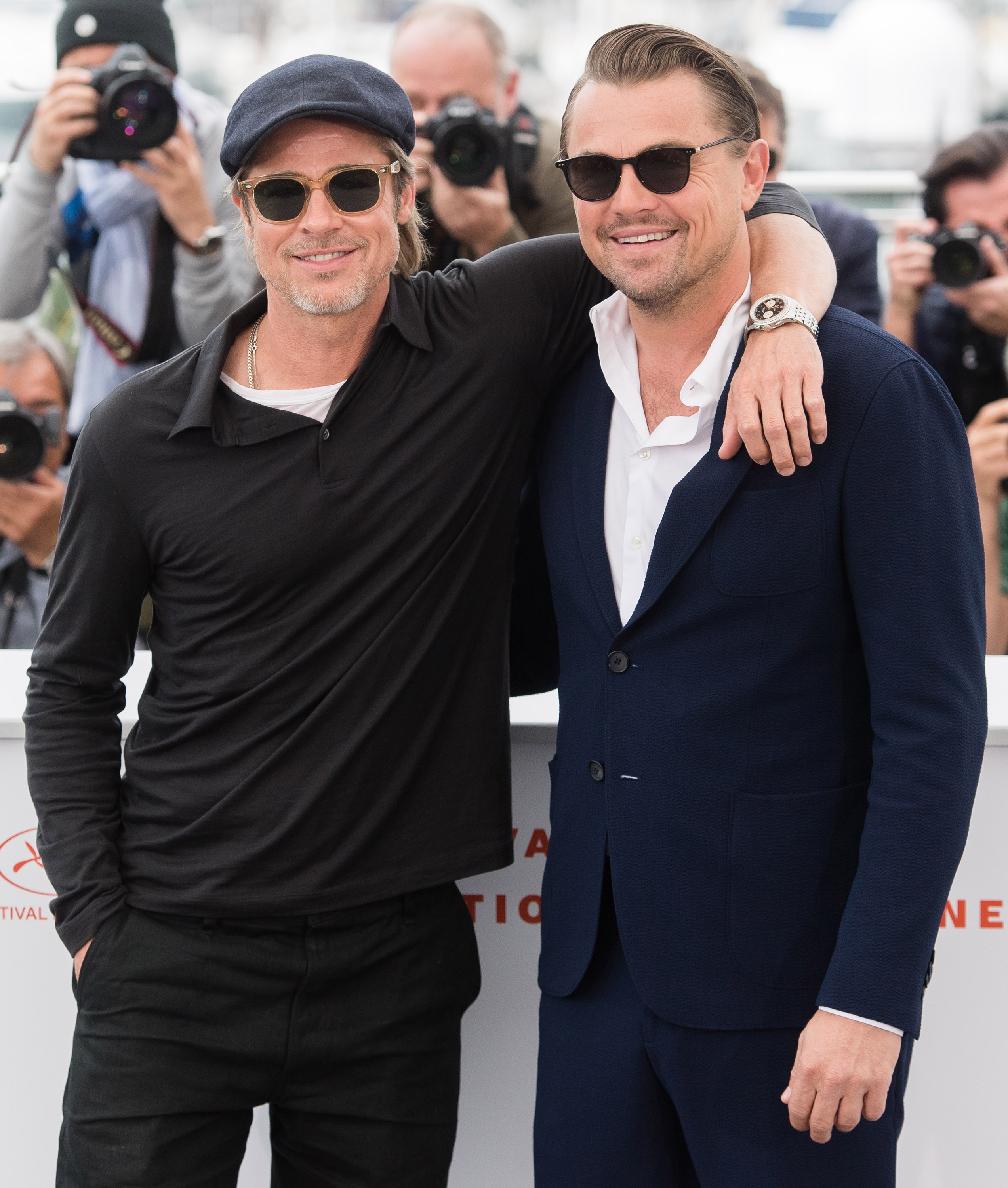 Brad Pitt and Leonardo DiCaprio attend a photocall for Once Upon A Time In Hollywood with Pitt wearing a Breitling watch.