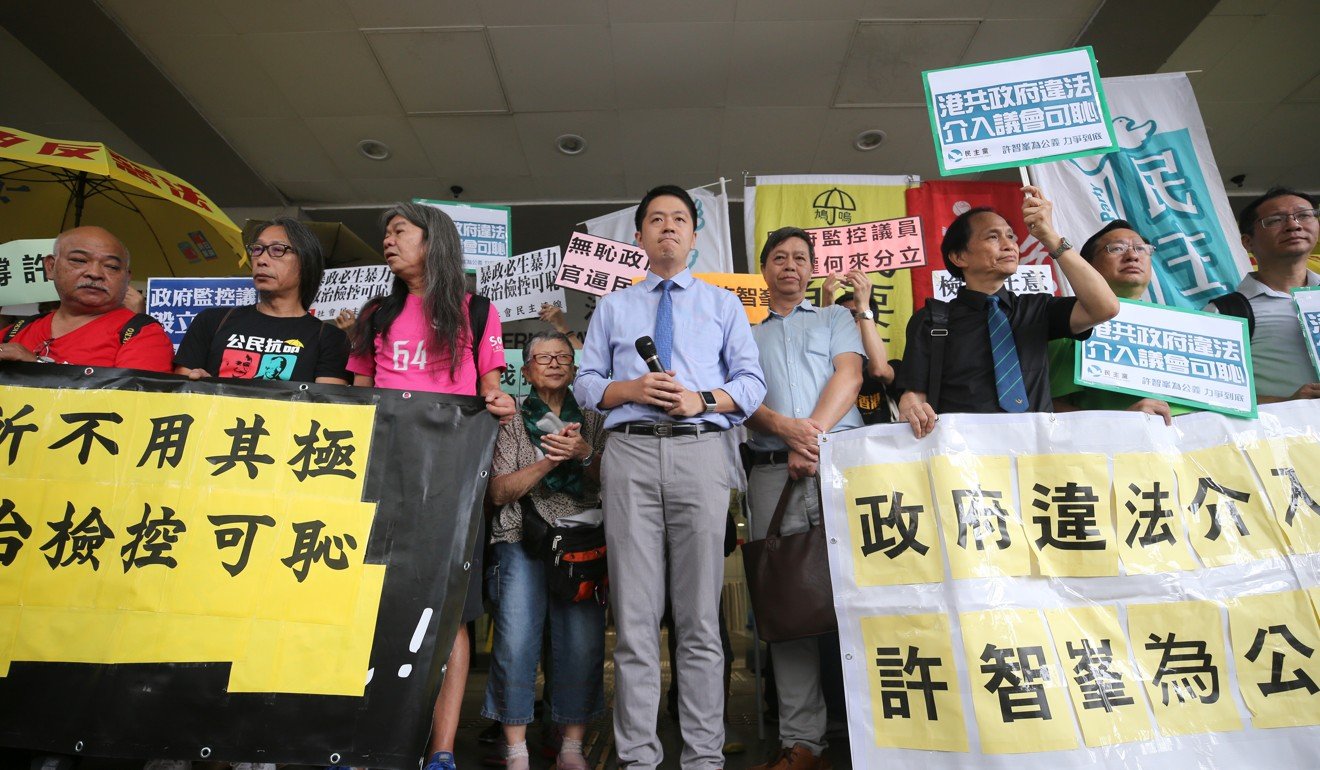 Lawmaker Ted Hui is flanked by his supporters after being found guilty in Hong Kong’s Eastern Court. Photo: Winson Wong