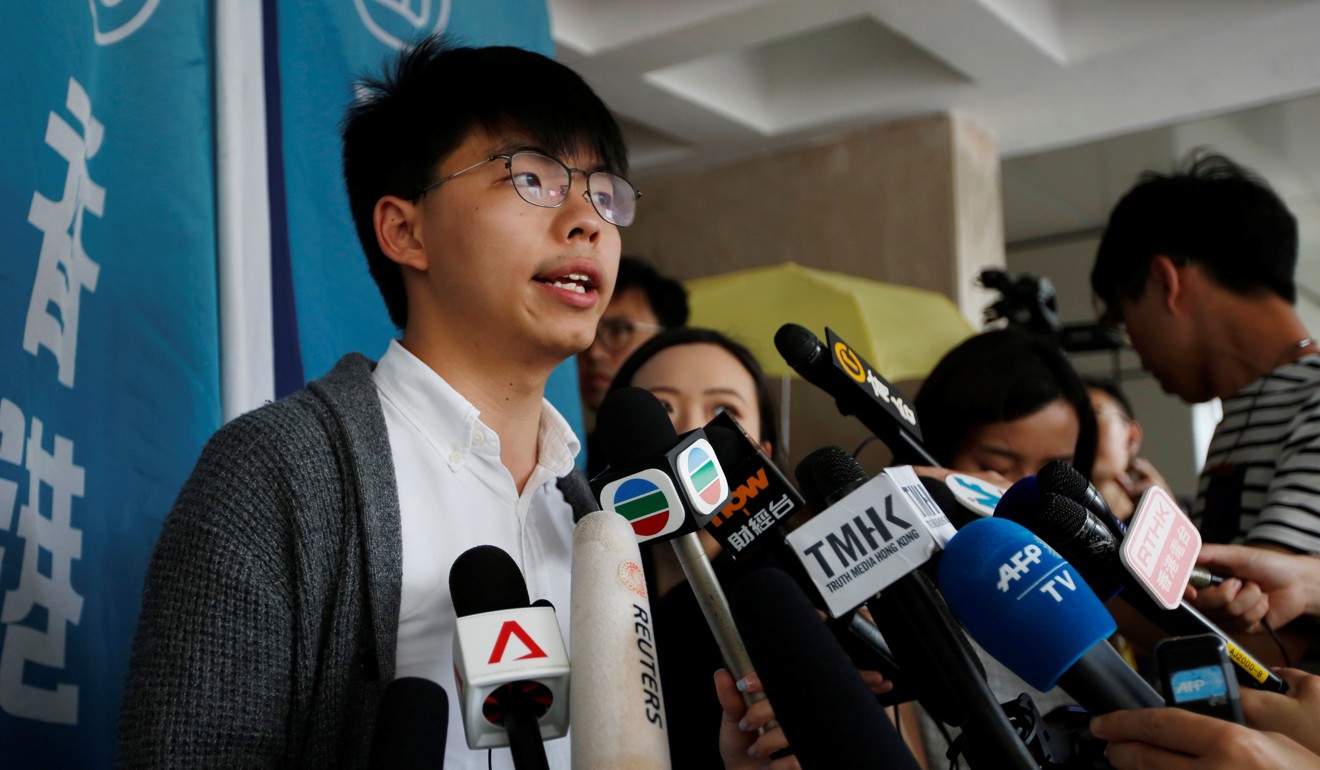 Hong Kong’s pro-democracy activist Joshua Wong speaks to members of the news media at the High Court this month. Photo: Reuters