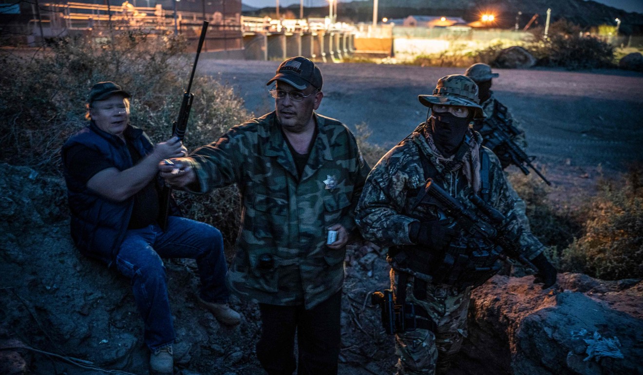 Jeff Allen (left) with members of the United Constitutional Patriots in Sunland Park, New Mexico in March. Photo: AFP
