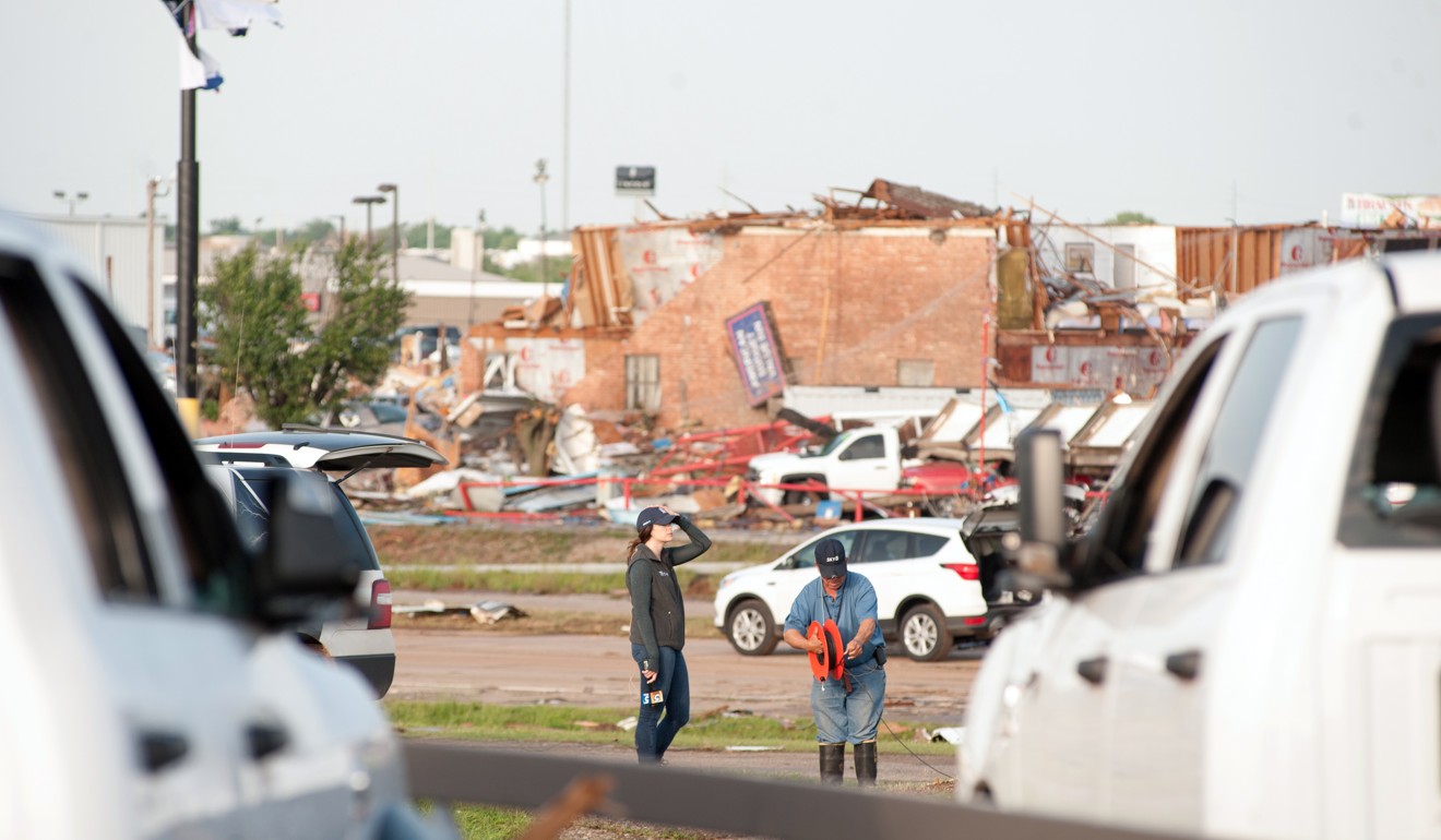 Authorities survey the damage after a large tornado hit the town of El Reno, Oklahoma on Sunday as storms and rain left flooding and destruction across the United States. Photo: EPA-EFE