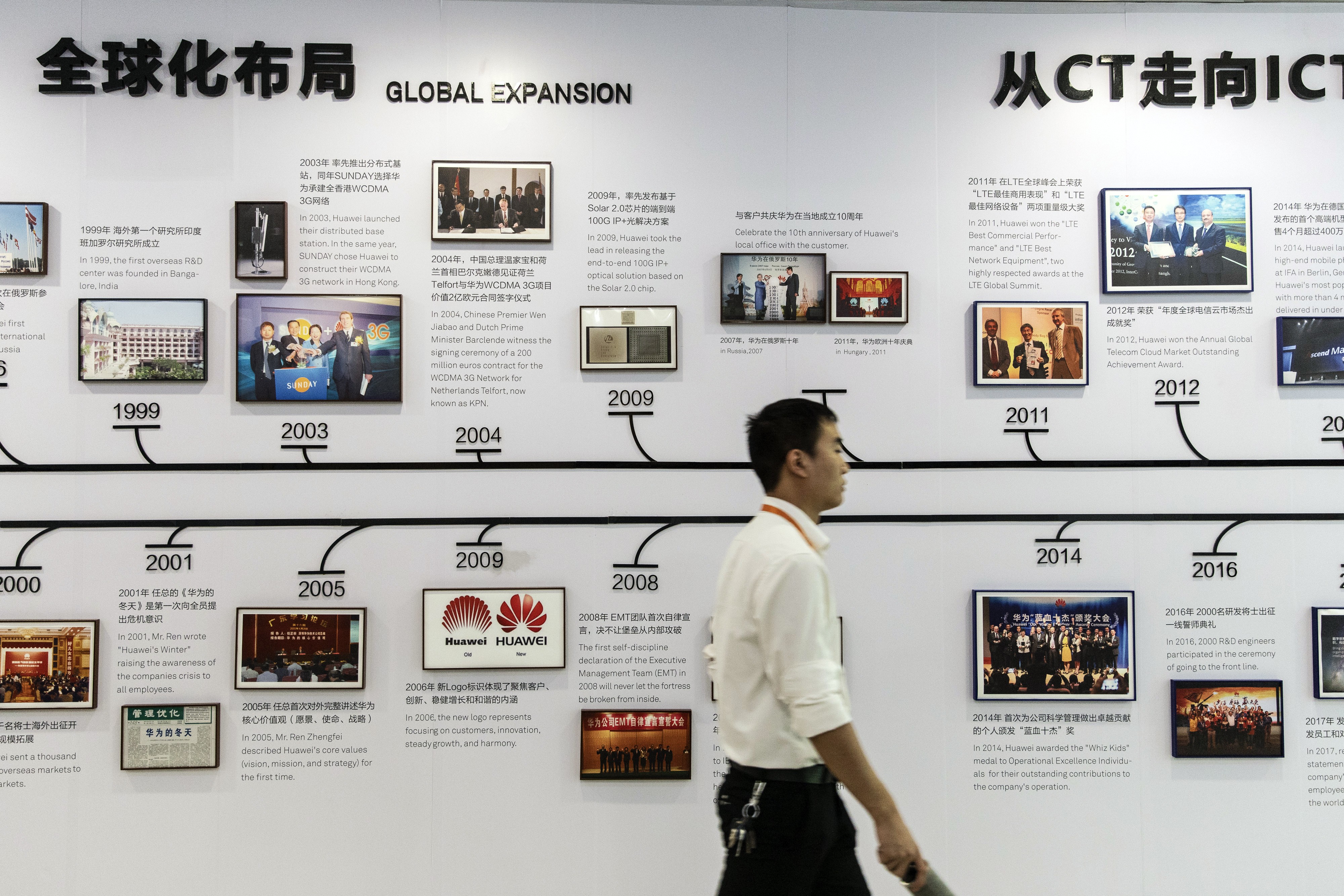 An employee walks past a display detailing Huawei’s history at the company’s training facility in Dongguan, China, on May 23. By targeting Huawei, the US has gone beyond the limits of a trade war. Photo: Bloomberg
