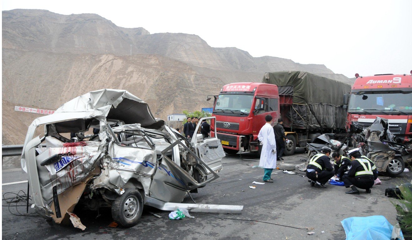 A heavy truck crashed into two minibuses on the G30 national highway in China's Gansu province, killing eight people. Photo: Xinhua/Song Changqing