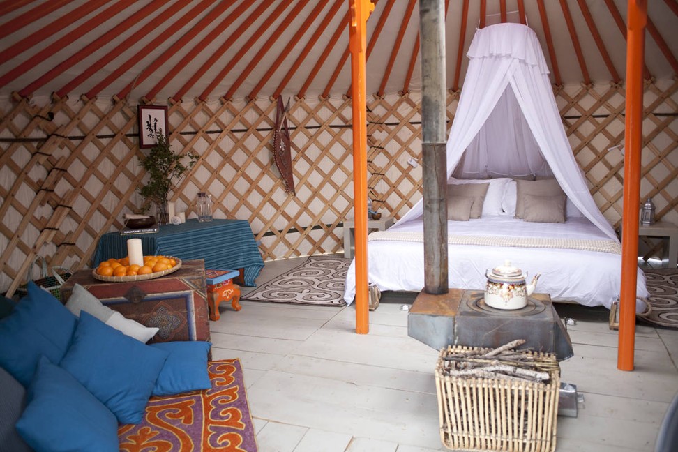 The bedroom ger is far from basic, with a super king mattress draped in netting. Photo: Mandala Mongolia