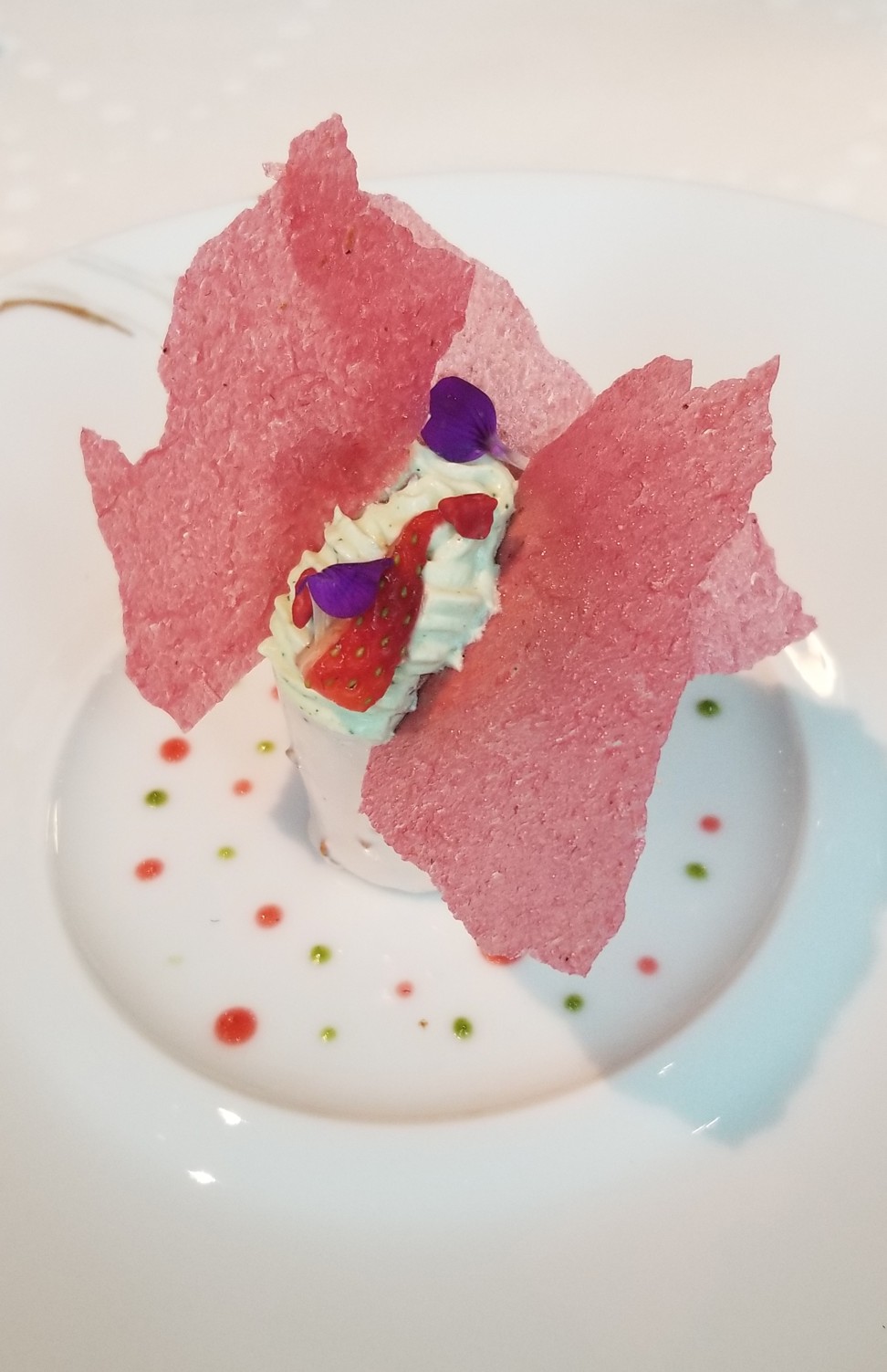 Strawberry roulade, with basil Chantilly and green apple sorbet, served at L’Envol