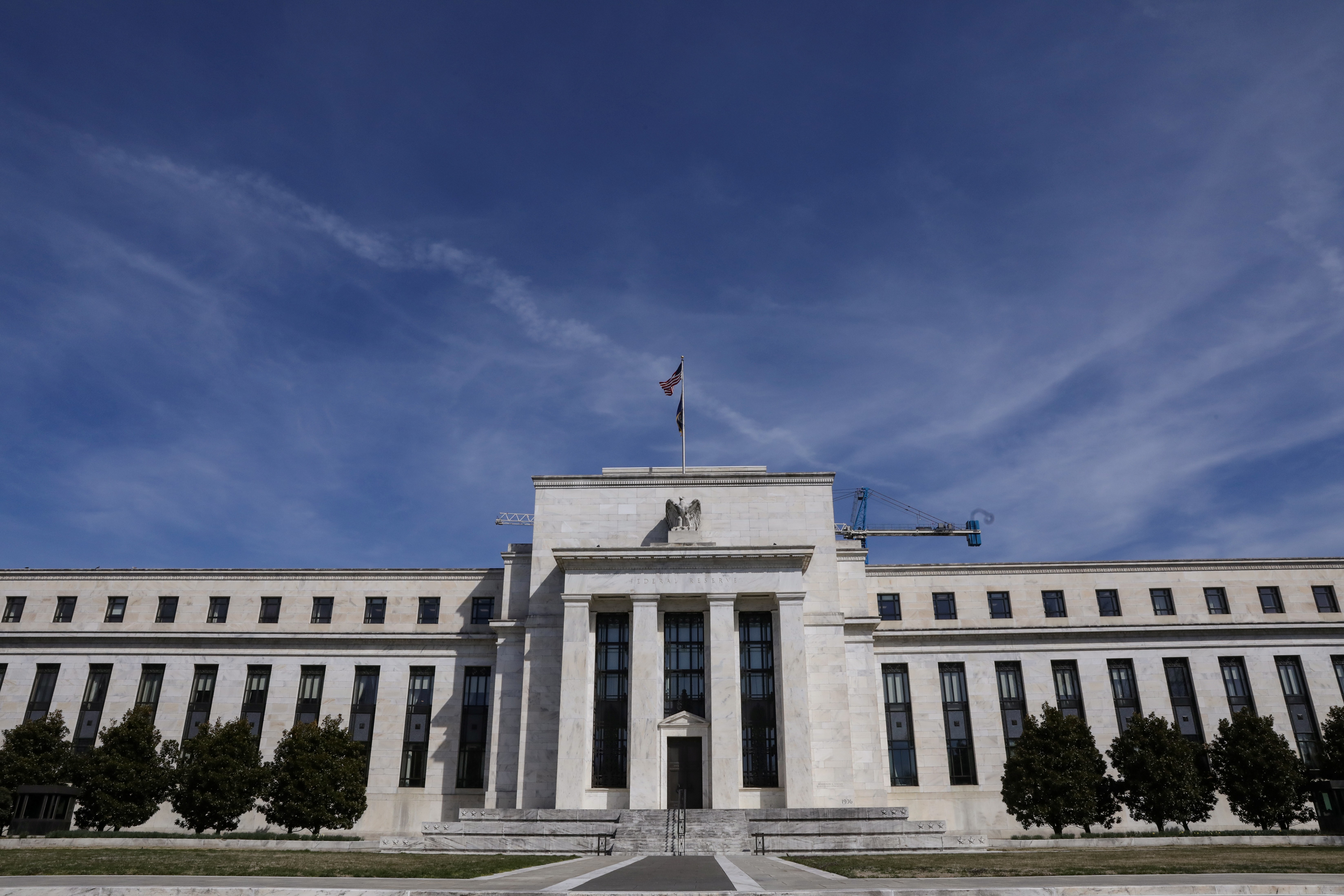 The Federal Reserve Board, whose building is seen here on Constitution Avenue in Washington, suggested that the unprecedented wave of quantitative easing undertaken by central banks around the world may have contributed to the flatter yield curve for Treasury bills. Photo: Reuters