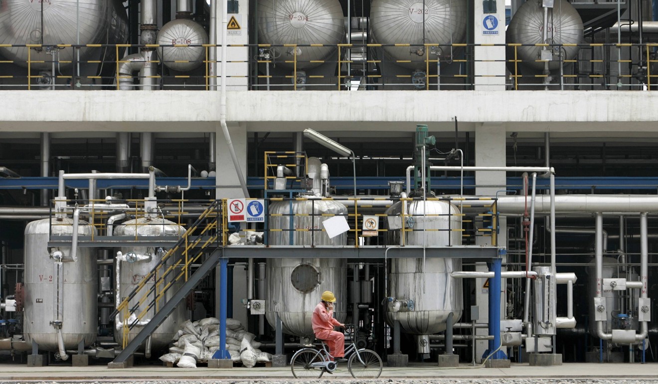 A worker cycles inside China National Petroleum Corporation’s Lanzhou Chemical Industry Company. Photo: Reuters