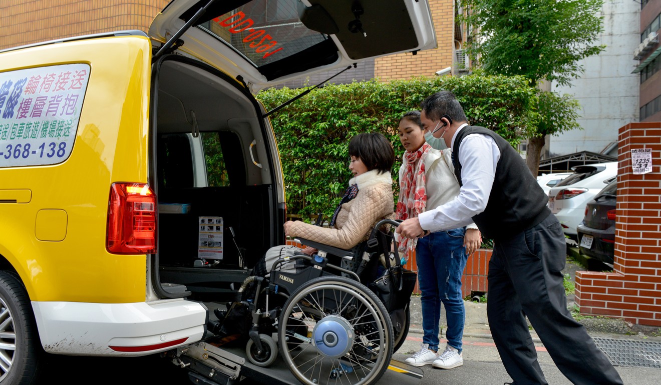 Yang is pushed into a specially modified taxi she uses to get around Taipei. “There is little dignity left if you can’t even do the simplest tasks,” she says. Photo: Chris Stowers