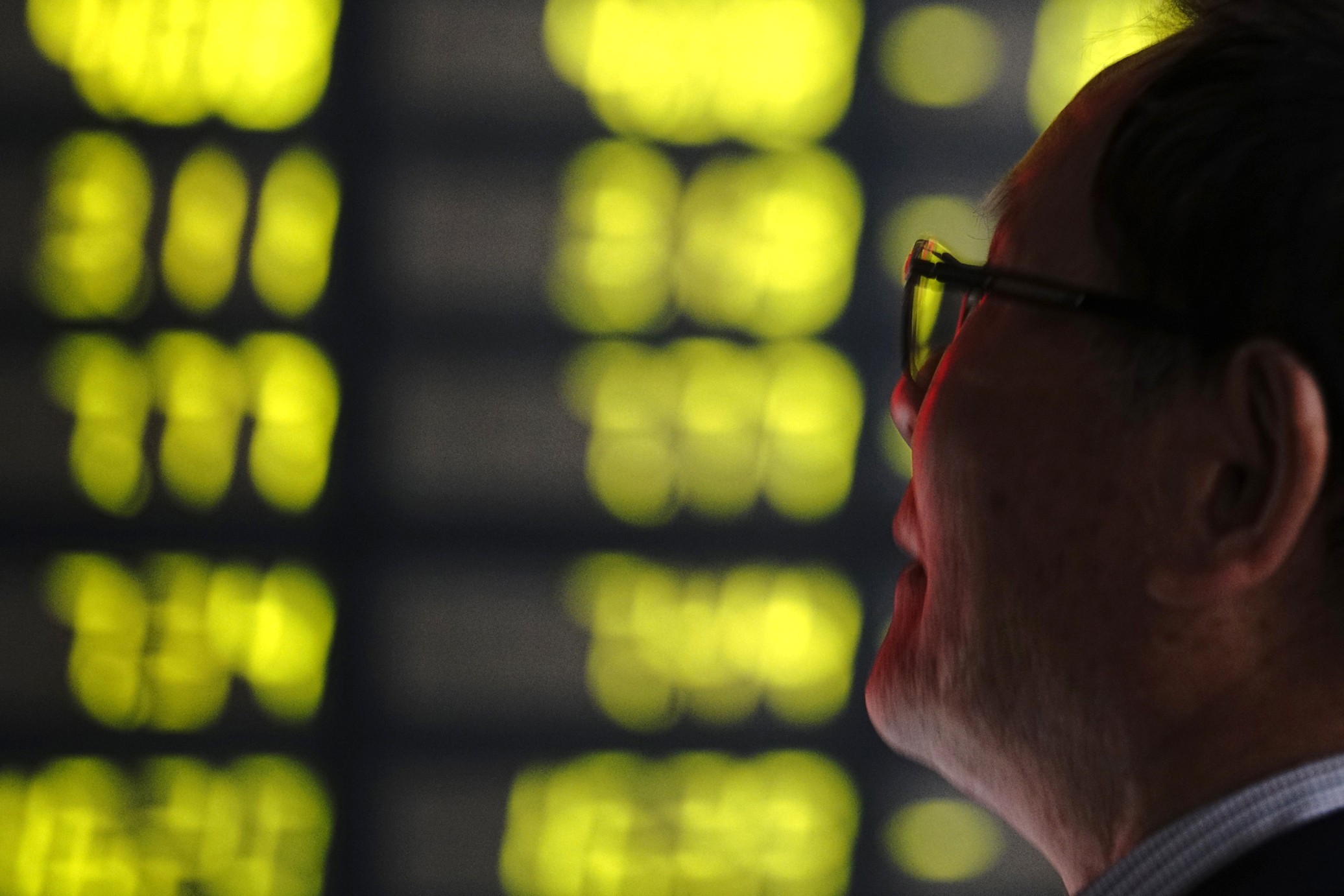 A man watches a display in green to mark falling stock prices at a brokerage house in Shanghai on May 6, 2019. The CSI 300, the benchmark that tracks blue chips listed in Shenzhen and Shanghai, was down 7.24 per cent in May. Photo: AP
