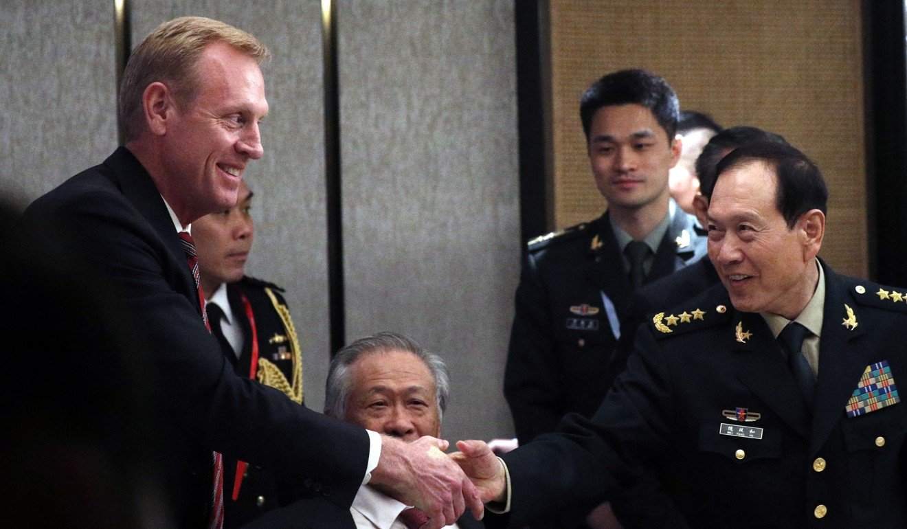 Acting US defence secretary Patrick Shanahan shakes hands with China’s Defence Minister General Wei Fenghe on the sidelines of the Shangri-La Dialogue. Photo: EPA-EFE
