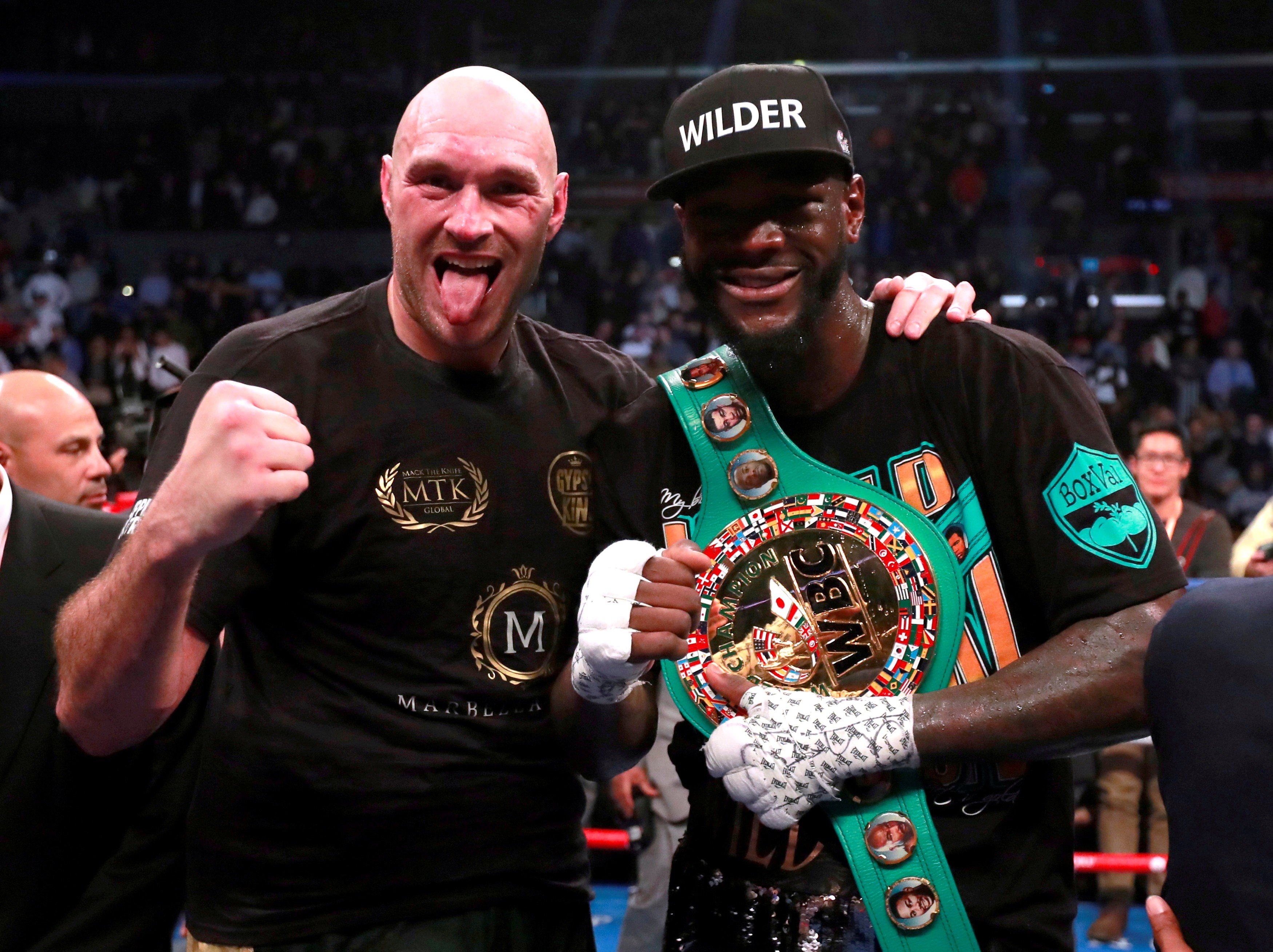 Tyson Fury and Deontay Wilder pose after their December 2018 fight. Photo: Reuters