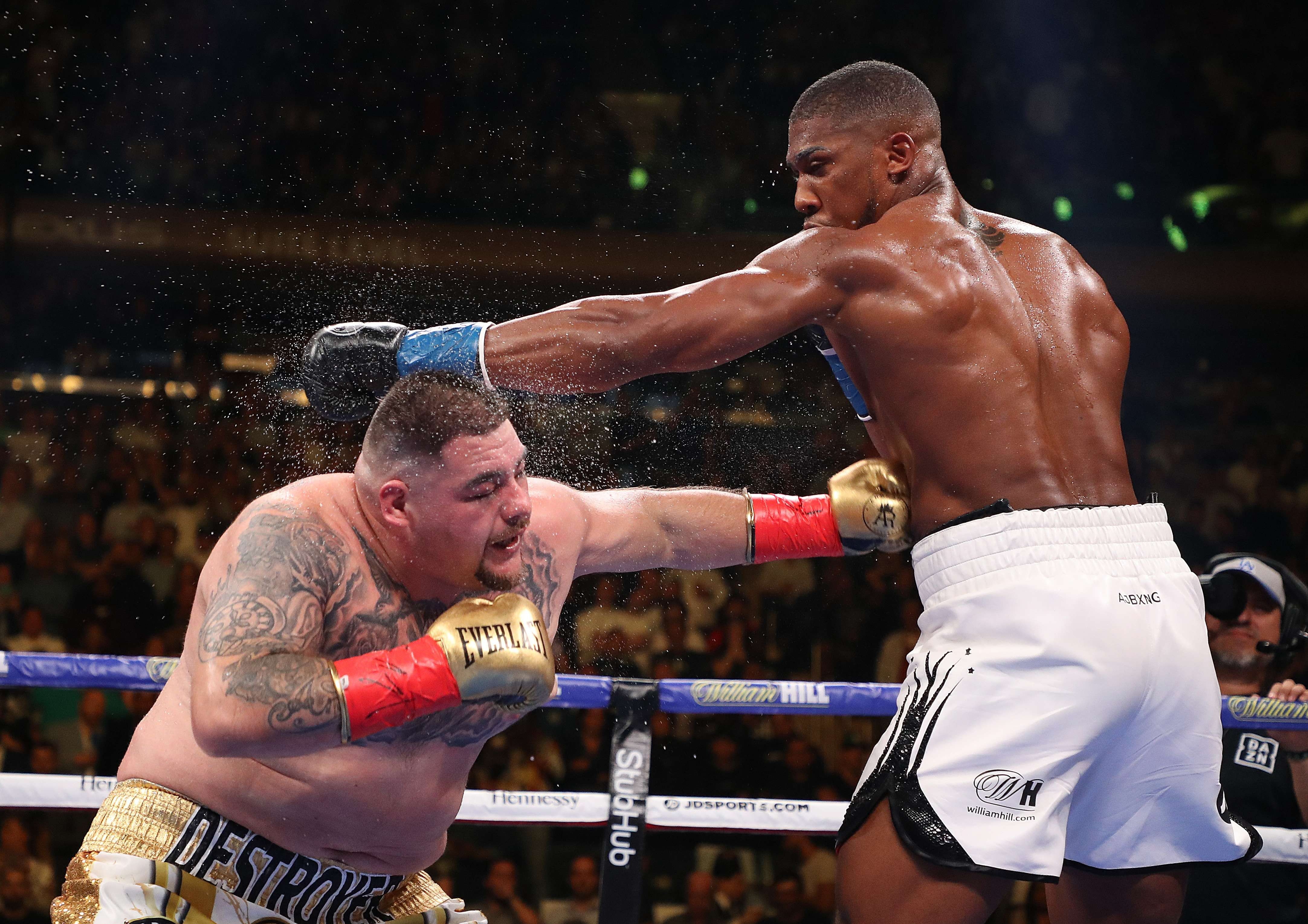 Andy Ruiz Jnr throws a hard left to the body of Anthony Joshua during their heavyweight title fight. Photo: AFP