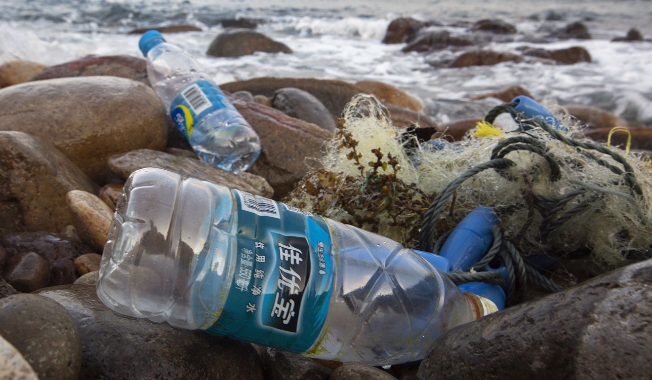 More than 11,000 bottles were found across Hong Kong beaches over the past year. Photo: EPA