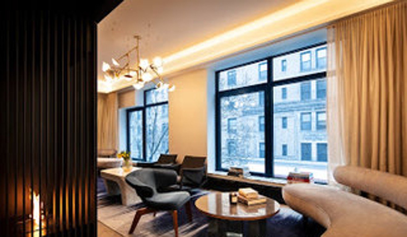 The lobby at E Madison includes a fireplace and art from a rotating collection. Photo: Equinox.