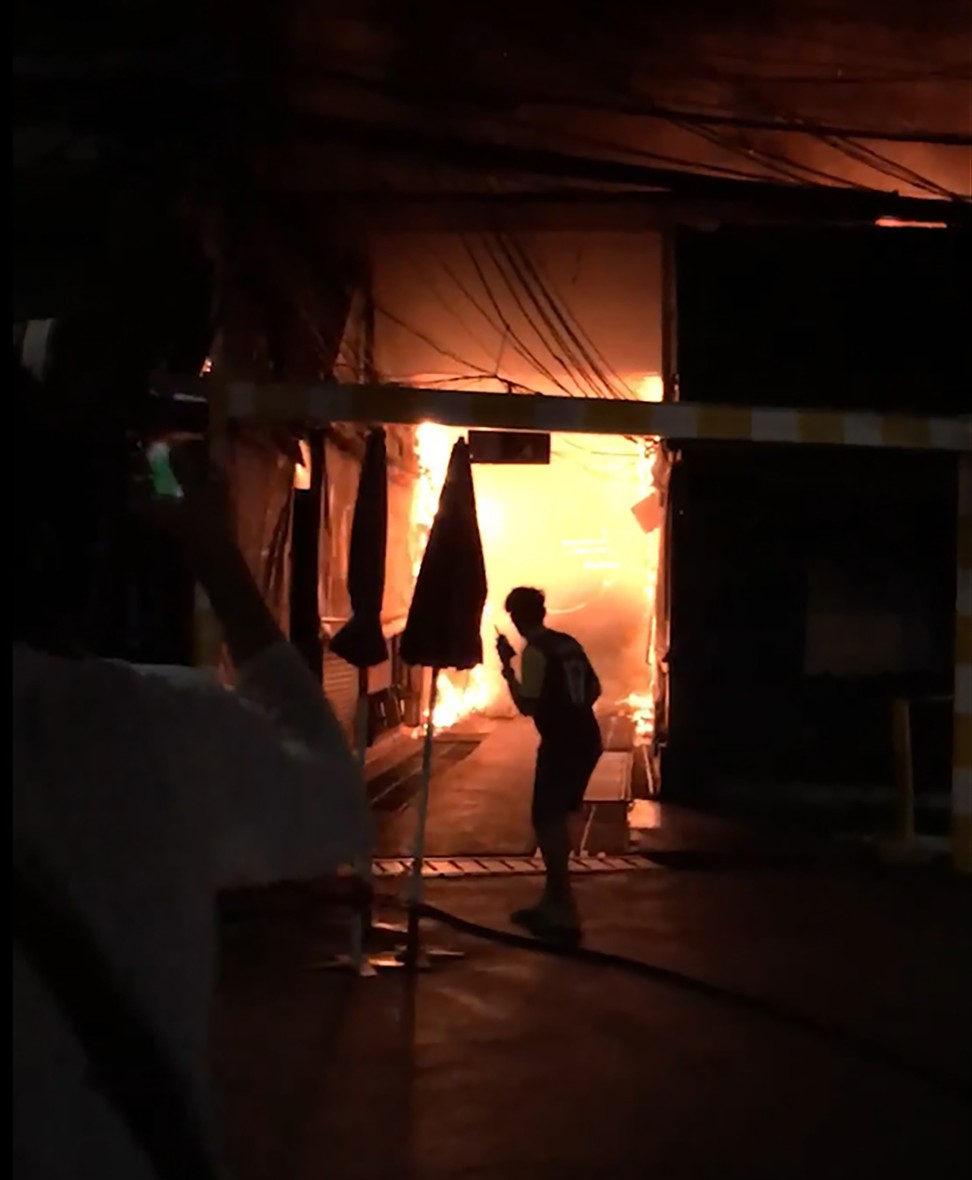 A fire roared through Bangkok’s Chatuchak market on June 2, destroying dozens of the small shops crammed inside one of Asia’s most popular bazaars. Photo: AP