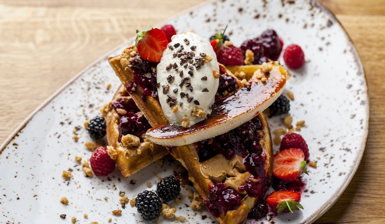 The full Elvis, featuring Belgian waffles with peanut butter and jam, banana brûlée, and Chantilly cream. Photo: Duck & Waffle