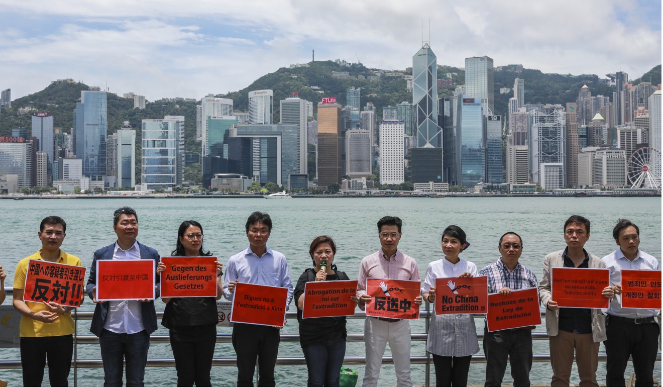 Delegates from Los Angeles and Canadian communities in Hong Kong oppose the extradition bill in several languages at Victoria Harbour in Tsim Sha Tsui. Photo: May Tse