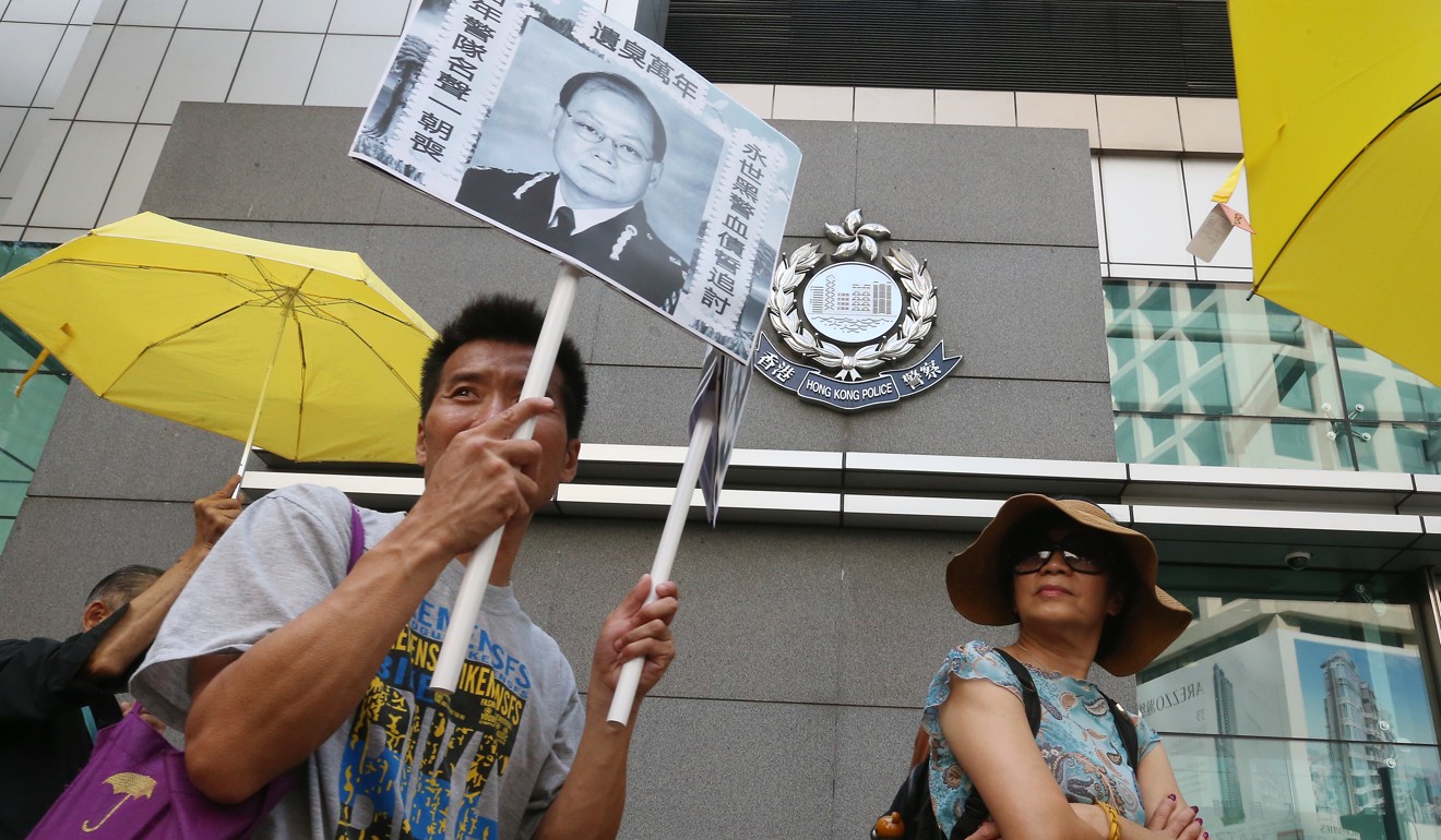 Demonstrators rally outside police headquarters in Hong Kong to celebrate Andy Tsang’s retirement from the force in 2015. Photo: SCMP