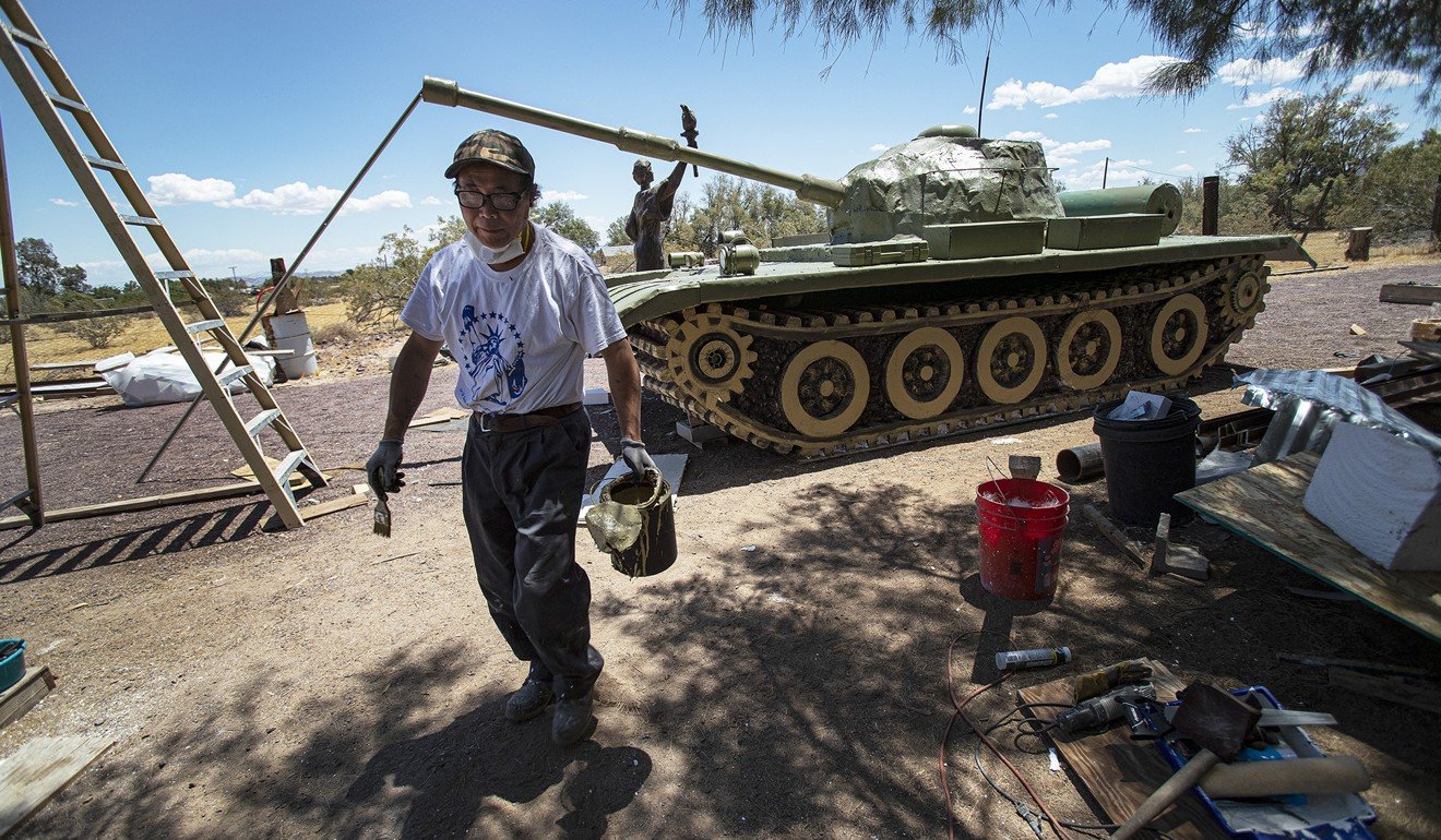 Sculptor Chen Weiming works on a tank he made out of styrofoam in preparation for a Tiananmen Square anniversary ceremony in Yermo, California. Photo: Los Angeles Times/TNS