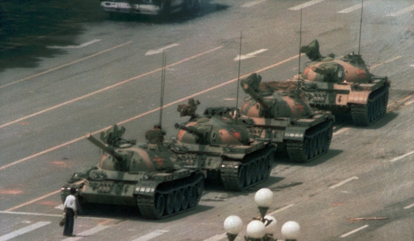 An unknown man stands alone to block a line of tanks in Tiananmen Square during the crackdown of June 1989. This famous image was published around the world and, to this day, nobody knows what became of ‘Tank Man’. Photo: AP/Jeff Widener