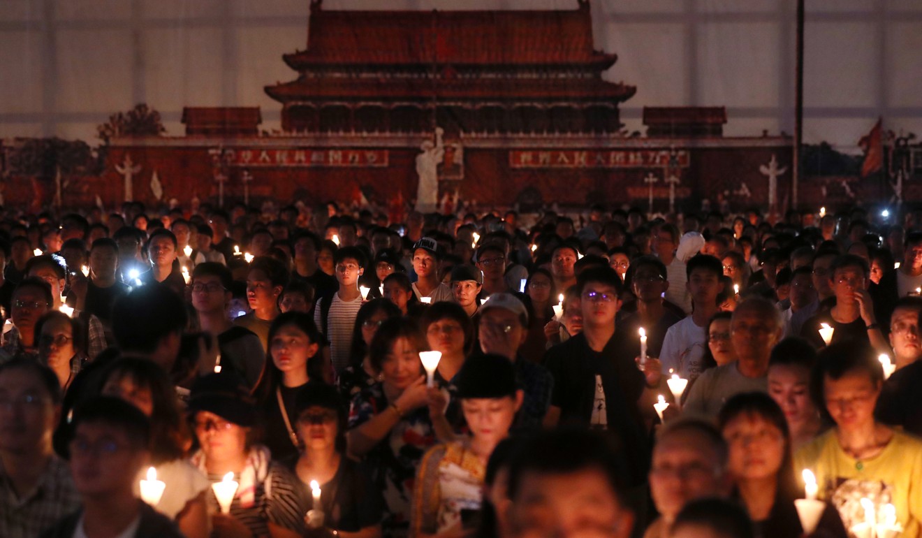People at the June 4 candlelight vigil at Victoria Park on Tuesday. Photo: Sam Tsang