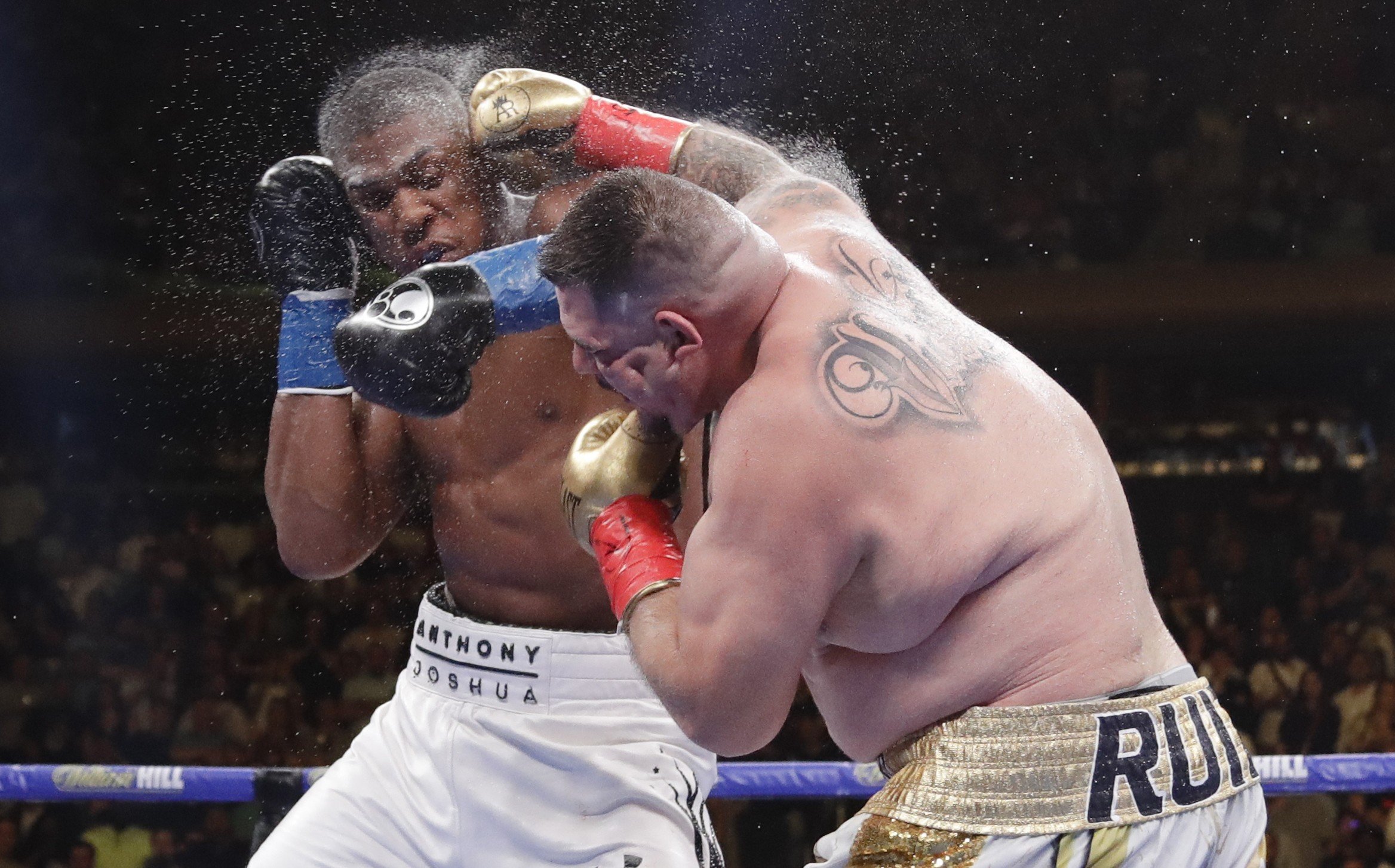 Andy Ruiz exchanges punches with Anthony Joshua during the seventh round in New York. Ruiz went on to stop Joshua and take his heavyweight titles. Photo: AP