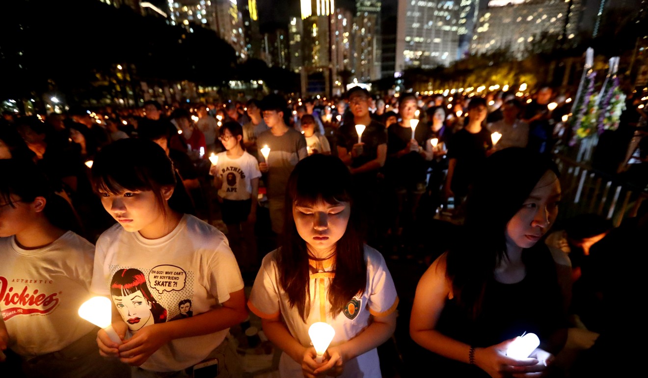 People hold candles at the June 4th vigil at Victoria Park in Hong Kong’s Causeway Bay commemorating last year’s anniversary of the Tiananmen Square crackdown. Photo: Nora Tam