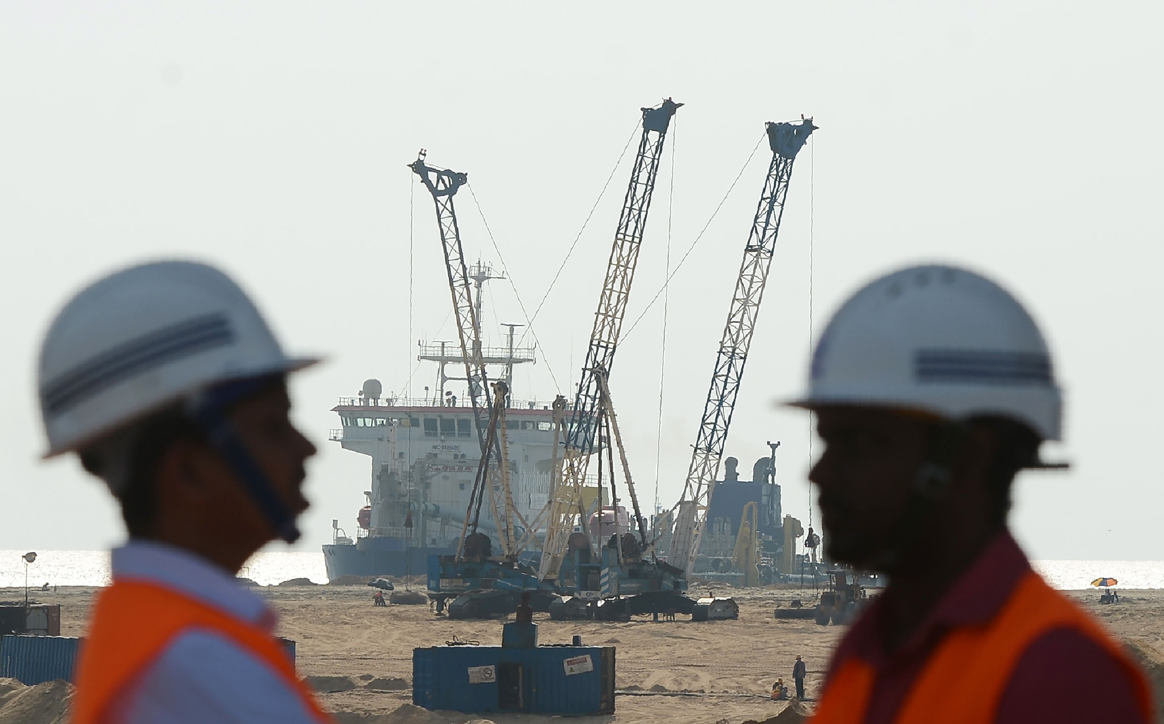 Pumps dredge sand near to Colombo’s main seaport. China, India and Japan are all helping Sri Lanka to develop the port. Photo: AFP