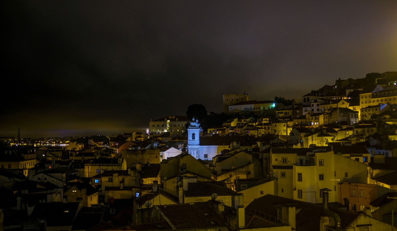 The Alfama neighbourhood in Lisbon at night. Photo: AFP