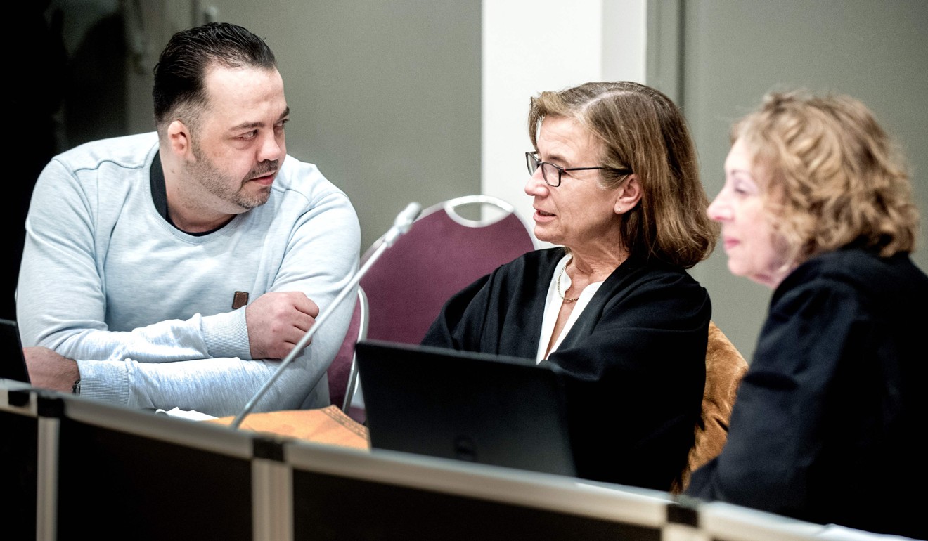 Hoegel speaks with his lawyers Ulrike Baumann (centre) and Kirsten Huefken in Oldenburg. Photo: AFP